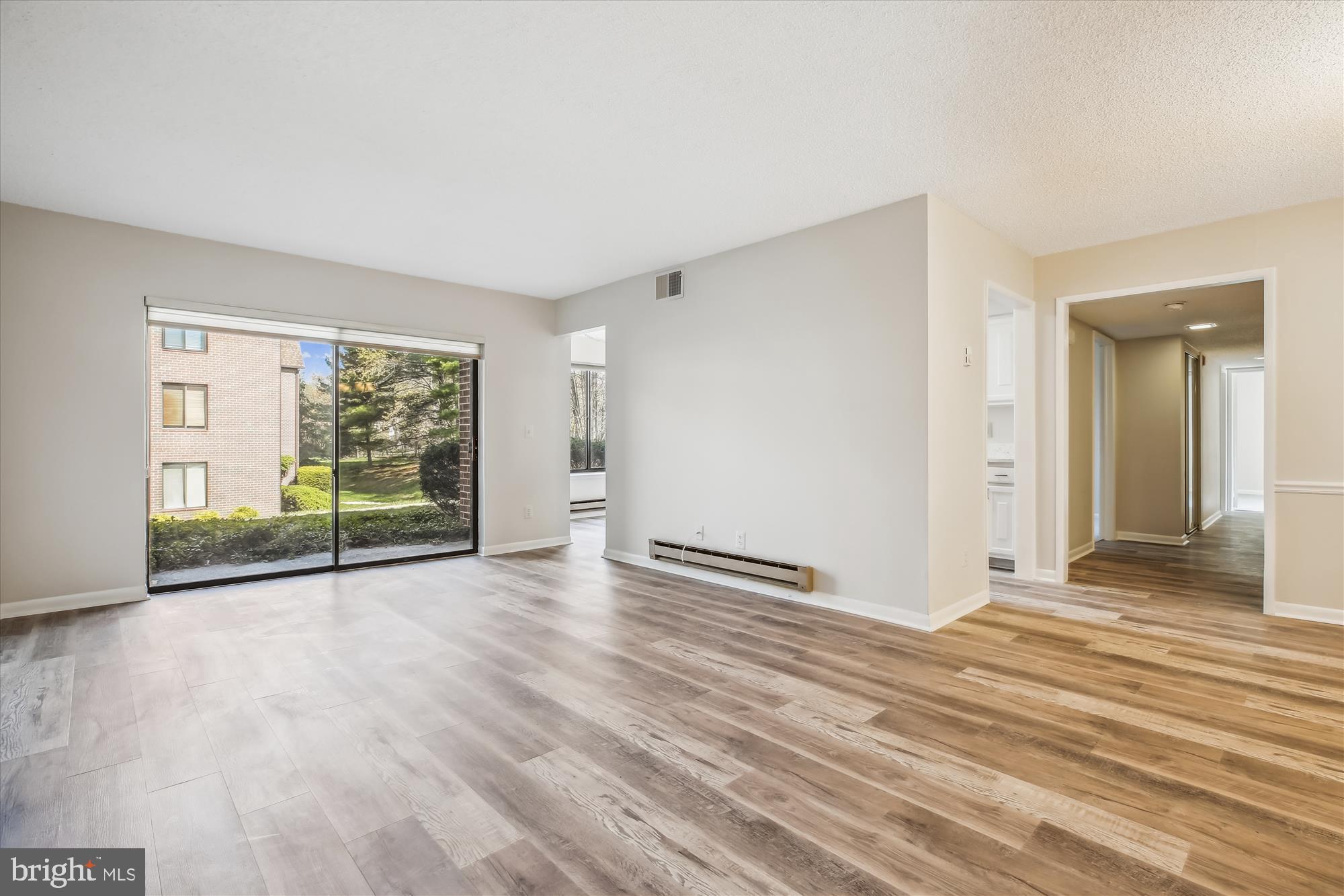 Welcome to your spacious new home! This beautifully updated first-floor condo features three generous bedrooms and two bathrooms, perfect for comfortable living. Step inside to find brand-new luxury vinyl plank flooring and plush carpeting throughout, all freshly painted to create a bright and inviting atmosphere. This home includes an updated kitchen, equipped with brand-new stainless steel appliances and stunning new countertops that make meal preparation a joy. Enjoy elegant new lighting that enhances the ambiance in every room, and updated bathrooms that offer both functionality and flair. Located in a thriving 55+ community, this condo provides access to a variety of amenities designed for leisure and social engagement. Whether you enjoy relaxing by the pool, participating in community events, or exploring beautiful walking paths, there’s something for everyone. Don't miss the opportunity to make this stunning condo your new oasis!