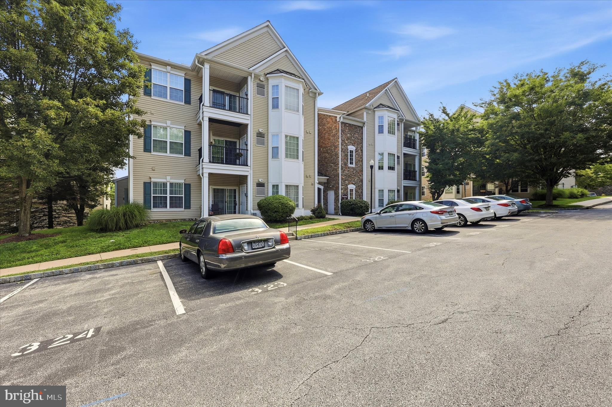 Welcome to Traditions at Ridley Creek! This bright and spacious second-floor unit offers 2 bedrooms, 2 baths, freshly painted for a move-in-ready feel. The inviting foyer has beautiful crown molding, and the living and kitchen areas feature hardwood floors, while the bedrooms are comfortably carpeted, creating the perfect blend of style and warmth. This home has it all with an open floor concept and a perfect downsizing space. There is plenty of storage space with a coat closet in the foyer, a large closet in the master bedroom, and even an extra closet with racks in the master bedroom. The spacious kitchen offers plenty of counter and cabinet space, along with a bright eating area that flows seamlessly into the living room and new stainless steel appliances, making it ideal for both everyday living and entertaining. The home also features an updated HVAC system and water heater installed in 2022, giving you added comfort and peace of mind. Enjoy peaceful views on your balcony, along with the added convenience of being just steps from your assigned parking space. This home is perfect for those with a small pet, offering easy outdoor access. Located in this well-established 55+ community, the home also includes a designated parking spot and a storage locker in Building  9. Residents love the vibrant clubhouse amenities, including a fitness room, game room, library, cozy fireplace, full kitchen, and an outdoor covered area perfect for gatherings and entertaining. Ideally situated near Philadelphia International Airport, major highways, rail lines, and top sports and entertainment venues, this location offers both convenience and lifestyle. The monthly fee of $310 covers nearly everything—grounds and common area maintenance, exterior building upkeep, health club access, insurance, lawn care, management, sewer, snow removal, trash, water, clubhouse, exercise room, game room, library, party room, and assigned parking—making for easy, low-maintenance living.
Enter the Community from BrookHaven Rd make a right, and building 3 is right on your left.