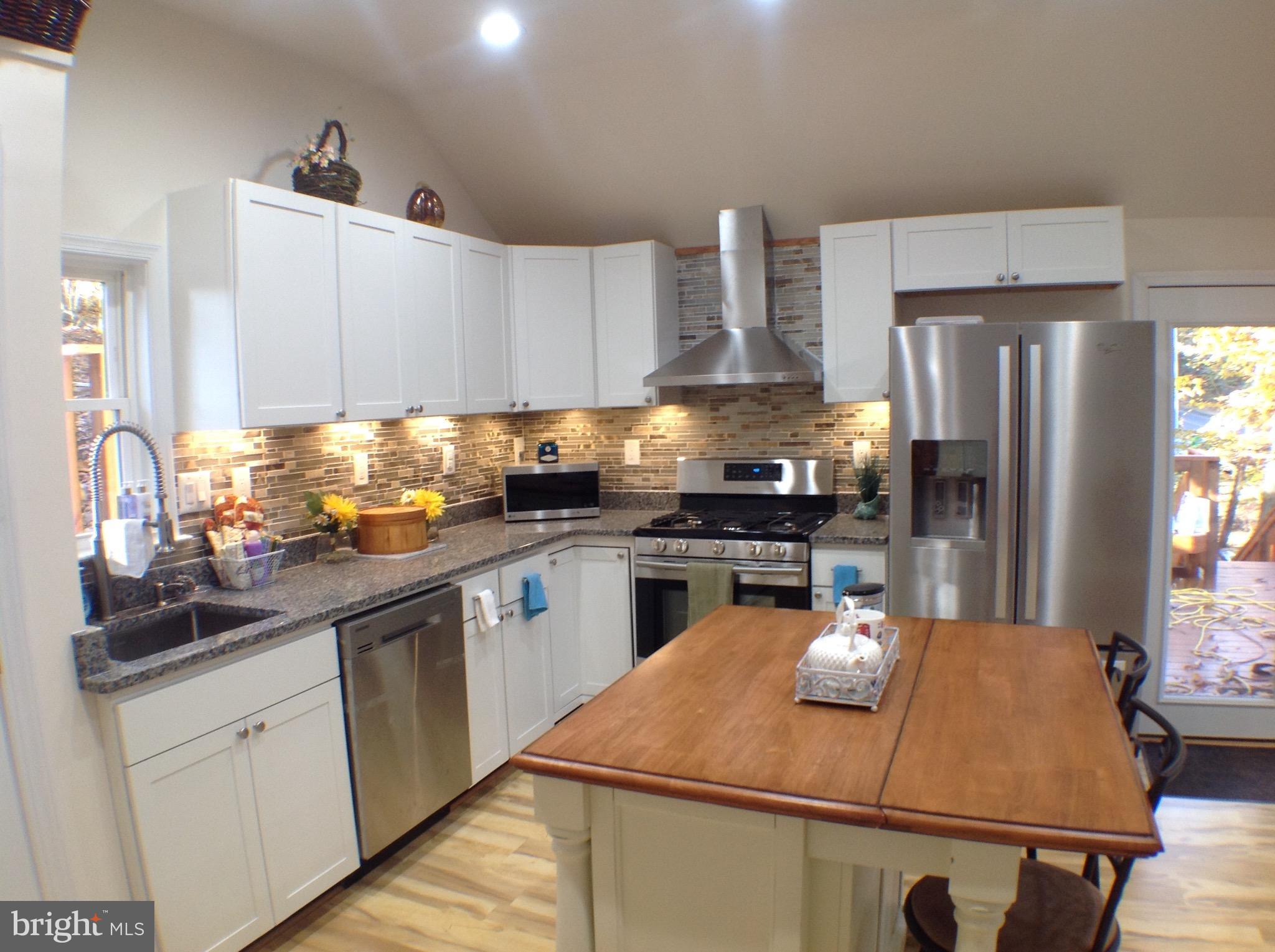 Brand new contemporary home.  Open concept, high end appliances, granite, MBR to die for, party deck, raised ceilings, Roman tile shower w/2 heads, private office, winder hardwood stairs, circle drive.  CRE means 2 community beaches, hiking trails, & private community airport.  Your forest setting means instead of tending a lawn, enjoy a laid-back lifestyle in an extremely attractive setting.