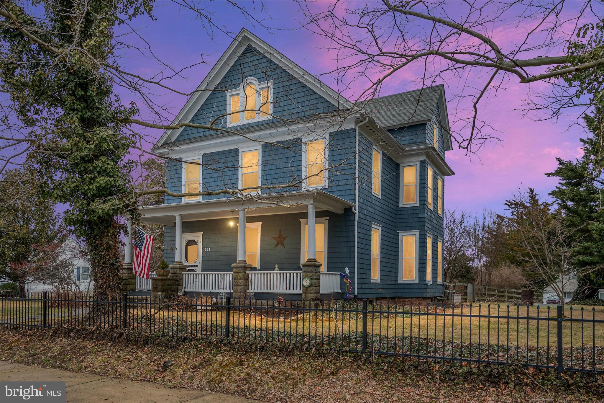 Welcome to 331 Kidwell Avenue, a stunning colonial in the heart of Historic Centreville, Maryland, where timeless architecture meets modern comfort.

Built in 1891, this beautifully updated home sits on a rare half-acre lot and offers over 2,700 square feet across four levels, all with NO HOA. The home’s exterior has been freshly painted, enhancing its classic curb appeal while preserving the character that makes historic homes so special.

From the moment you step inside, you’re welcomed by a grand foyer highlighted by 10-foot ceilings, detailed custom trim work, and original hardwood floors that showcase the home’s historic charm.

The updated kitchen features modern appliances, abundant built-in storage, and generous pantry space, making it both functional and inviting. Just off the kitchen is a sun-filled formal dining room and a spacious living area framed by beautiful custom trim, perfect for entertaining or everyday living. A half bath and mudroom complete the main level.

Upstairs, elegant railings lead to the second floor where you’ll find four large bedrooms, a full hallway bathroom, and a convenient laundry area.

The entire third level is dedicated to the primary suite, creating a private retreat with a massive walk-in closet, built-in storage, and an impressive ensuite bath featuring a stand-alone soaking tub, tiled shower, drying area, and vaulted ceilings.

The lower level basement offers excellent storage space and houses the sump pump and updated HVAC systems.

Step outside through the mudroom to enjoy the partially fenced backyard with mature trees and a beautiful flagstone patio, perfect for relaxing or entertaining.

The property also includes a detached garage, a paved basketball court, and additional fenced yard space ideal for gardening or outdoor activities.

Located within walking distance to Centreville High School, Centreville Middle School, and Kennard Elementary, this home also offers easy access to shopping, dining, the Queenstown Outlets, and major Eastern Shore destinations including Annapolis, Easton, St. Michaels, Kent Island, and the Delaware beaches.

Historic charm. Modern updates. Space that’s nearly impossible to find in downtown Centreville.

All that’s missing… is you.