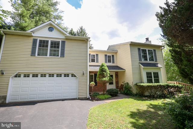 Nestled in the charming North Carroll Farms community, this delightful Colonial home offers a perfect blend of comfort and functionality. With 4/5 spacious bedrooms and 2.5 bathrooms, this residence spans over 3830 sq ft, providing ample space for relaxation and gatherings.  Step outside to a 1.87-acre lot, with lush greens and landscaping, to include gardens and lower lot stream.  The heart of the home features a traditional floor plan with a cozy family room off the kitchen, ideal for entertaining. The country-style kitchen boasts an island and an eat-in area, perfect for casual meals or morning coffee. Enjoy the warmth of a wood-burning fireplace in the inviting living space, complemented by beautiful wood floors. The upper-level laundry adds convenience to your daily routine, a unique upper-level floor plan allows for private space and lots of versatility.   The unfinished basement offers endless possibilities for customization.  shed/outbuilding for additional storage or hobbies. Located in a vibrant neighborhood, residents benefit from nearby parks and community amenities that foster a sense of belonging. Explore local trails, enjoy recreational activities, or simply unwind in the serene surroundings. This home is not just a place to live; it's a gateway to a fulfilling lifestyle in a welcoming community. Experience the perfect blend of comfort, space, and community in this charming North Carroll Farms residence. Original build approved for 3 BR septic- * New roof 2025 with transferrable warranty