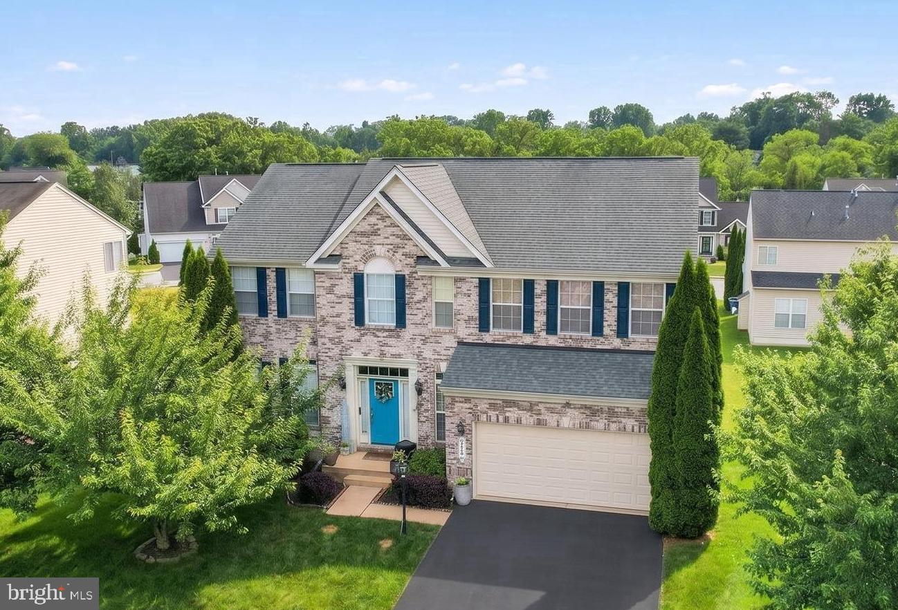 Spacious home in the Brownstone neighborhood with exceptional community amenities including a swimming pool, clubhouse, fitness center, basketball court, and scenic walking paths. This spacious home offers a bright and open layout with a finished lower level. 

The heart of the home is the kitchen featuring stainless steel appliances, including a double oven, and an adjoining breakfast room surrounded by wall-to-wall windows that fill the space with natural light. A door from the breakfast area leads to the deck, creating the perfect setting for morning coffee or outdoor entertaining. The kitchen flows seamlessly into the family room, while a formal dining room and living room provide additional spaces for gatherings and everyday living. A convenient first-floor laundry room and powder room complete the main level.

The upper level features a spacious primary suite highlighted by a cozy fireplace, an expansive walk-in closet, and plenty of room to unwind. Three additional bedrooms and a full guest bath provide comfortable accommodations for family and guests.

The fully finished lower level significantly expands the living space and is ideal for entertaining or multi-purpose use. Enjoy a large recreation area complete with a wet bar, a dedicated movie room wired for surround sound, a private office, a full bath, and a potential fifth bedroom. With abundant living space across all three levels and access to outstanding community amenities, this home offers the perfect blend of comfort, functionality, and lifestyle.