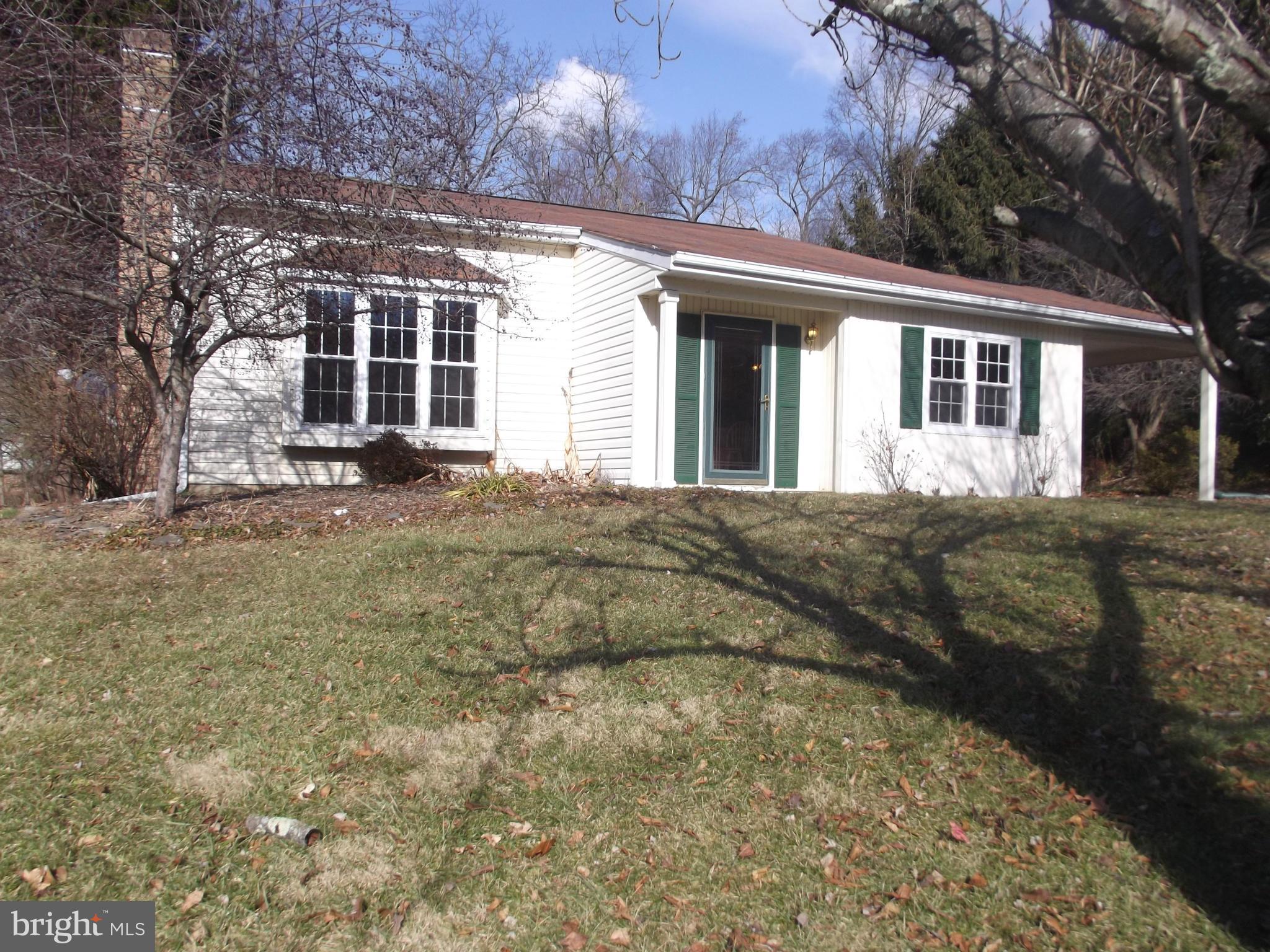 Lovely tri level split home w/ open floor plan located on a private street.  large eat in kitchen, wood stove insert in living room w/ brick hearth, laminate flooring on main and third level. Large family room with sliders to spacious back yard. 2 sheds on property, lots of trees for shade and privacy, attached carport.  Carroll Co schools, Finksburg location, Home warranty included