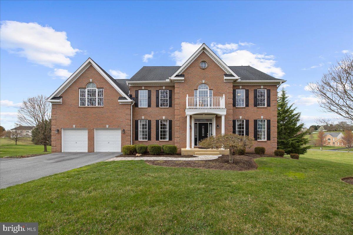Nestled on a prime corner lot surrounded by community open space on two sides, this luxurious home offers serene views, privacy, and a thoughtful easy flowing design perfect for modern living. You will find exquisitely maintained & upgraded spaces throughout - a grand two story entry foyer greets you through the main entrance; impressive hardwood flooring stretches across the main level including entertainment sized formal living & dining rooms;  an open concept gathering area -family room with gas fireplace & study area & the expansive, on trend eat in kitchen with island, granite counter & stainless steel appliances. This entire space is flooded with glorious natural light! Daily living is instantly elevated with an oversized mudroom & laundry room off of the large garage (with epoxy coated flooring & built in cabinetry) with amazing walk in closet space & convenient access to the rear stair case to the upper level.  The upper level has 5 bedrooms (including 2 primary suites) & closet space galore, plus all new carpeting & ceiling fans + 3 updated baths too. The expansive, walkout finished lower level is sure to please with 9' ceilings - a perfect retreat for sports & movie watching, working out, crafts, hobbies & even more great storage space. Get ready to enjoy relaxing & using the large deck with hot tub off of the kitchen & the serene, custom stone patio with stone wall. This stunning property is loaded with wonderful touches - crown molding on the main level & upper hall, handsome hardwood stairs, dual zoned HVAC with smart thermostats, invisible pet containment fencing, butlers pantry with wine refrigeration & wall mounted television in main family room convey. Let's hear it for the thoughtful & caring owners for these: new front door system 2016 | 2 upper level bath renovations 2016 | new roof 2016 | repaved driveway 2018 | patio with in wall landscape lighting 2021 |  painted kitchen cabinets 2021 | hardwood floor refinishing 2024 | kitchen refrigerator with craft ice maker 2022 | washer 2018 | dryer 2019| dishwasher 2017 | stove 2016 (electric, but there is gas available behind the stove | main zone inside AC coil 2024 | HVAC main zone blower motor 2024 | 2nd zone heat pump system 2014 | water back up sump pump 2019 | septic pumped & inspected 2022.  Move in just in time to enjoy all of the fantastic area parks & amenities that this vibrant area offers.