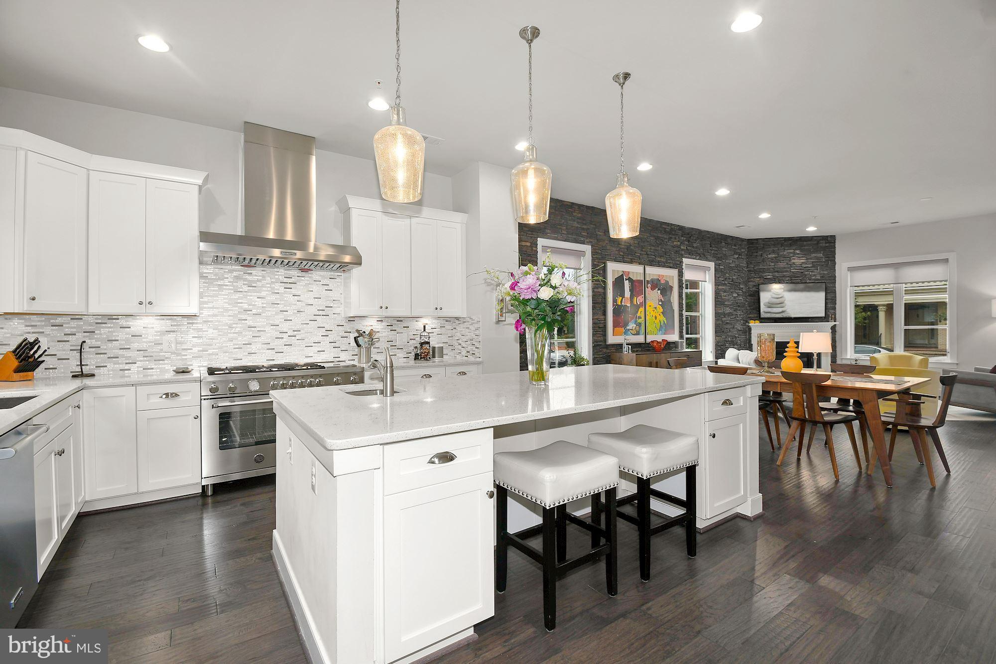 ****SOLD**** $50k ABOVE ASKING IN JUST 3 DAYS!! *****  Luxury, Lifestyle, Location all found in DC Metro’s most modern and commuter friendly neighborhood of Potomac Yard. This spectacular 5 bedroom, 4.5 bathroom, end unit, executive townhome w/detached 2 car garage/carriage house,  includes all of the high-end features and amenities you’ve been waiting for! You’ll fall in love with the oversized Ice White Quartz kitchen island that provides 40 sqft of counter space not to mention the spa like soaking tub in the primary en-suite, of which are only found in this 24’ wide floor plan!  Being on the end also certainly has its perks!  All the extra windows on the outer wall makes this one sun-filled gem like no other! Enjoy the 10’ ceilings on the first floor (9’ on all upper floors), chic stone clad accent wall in the dining/living room, SS appliance package w/new Bertazzoni 6 burner gas range & range hood, 3 ovens, under cabinet lighting, walls of 42’ white cabinets, and mudroom off the kitchen are just a few noteworthy items of just the main level!  Upstairs you’ll find the primary bedroom of your dreams: bring your king size bed, oversized dressers, enjoy a good book in the sitting area, or relax with a cup of coffee on one of the 2 balconies in this primary retreat!  California custom closet systems in both closets, luxurious en-suite comes w/ upgraded marble finishes, private commode, elegant and spacious frameless shower w/bench, window above soaking tub, dual vanities, and built-in linen cabinet! 3rd floor has 2 more spacious bedrooms, full bathroom, laundry rm, and one impressive family room great for watching your favorite sports games or creating an art studio/ home gym! Head to the 4th floor rec room to enjoy movie night with the built-in surround sound, full wet bar w/beverage cooler, another full bath and cozy up to the dbl sided gas FP inside or walk out onto the expansive roof deck terrace to enjoy phenomenal views of Potomac Yard and amazing firework displays on the 4th! 
One of the truly unique features of this highly sought-after layout is the detached carriage house. Not only does the carriage house provide you w/an abundance of additional storage space in the oversized, side loading 2-car garage but comes fully equipped with over 400 sq ft of living space in the studio apartment/in-law suite above! Separate HVAC/hot water heater, kitchenette set up w/beverage cooler, full bath, & tons of windows! Whether you seek turn-key luxury inside, or a multitude of entertainment areas outside, you’ve found yourself the one home that truly checks all the boxes! 
Potomac Yard is considered one of the best places to live because it affords the neighborhood feel, yet walkable to your favorite restaurants/shops/parks in Del Ray, & if all goes as planned by Spring this year you will also be able to walk to the Potomac Yard Metro Station (blue/yellow lines)! If driving is more your jam, less than 10 mins to Old Town Alexandria or Reagan National Airport. 2 miles north is Amazon HQ2 construction well underway with expectations to complete phase 1 of their two office buildings and 50,000 sq ft of retail space in 2023. If this weren’t enough to quench your thirst for your best investment purchase ever made, Virginia Tech’s Innovation Campus will eventually make its home on 3.5 acres of new mixed-use space adjacent to the future Potomac Yard Metro station in 2024!  The steady growth of home values in Potomac Yard will continue to thrive, despite the market conditions elsewhere, especially now that these community transformations are within arm’s reach! So, make the right decision to call 2108 Main Line Blvd “Home” today, and avoid feelings of immense remorse & regret of not doing so later down the road! You will be SO glad you did!