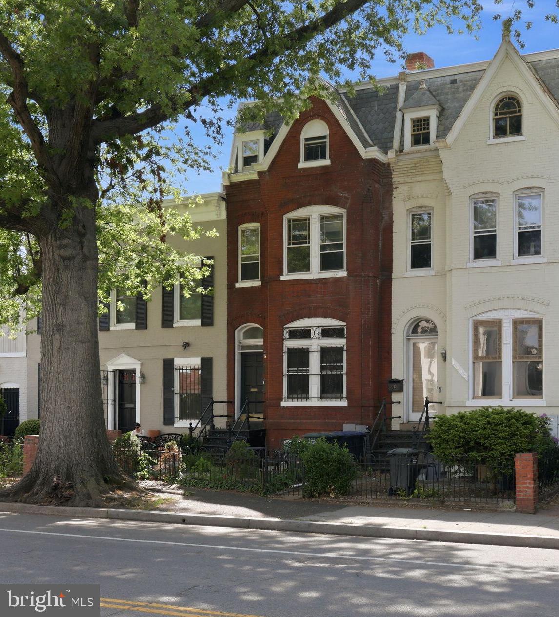 Exceptional 1906 historic Victorian rowhouse updated and renovated into two spacious bi-level 2 BR apartments. C of O for two units, separately metered and self-contained. The building contains 4  levels which includes a basement with storage space and laundry facilities. Large rooms with high ceilings can be found through most of the building along with wood floors, built-ins and skylights. Each apartment has 2 bedrooms and 1 1/2 baths, with light-filled living spaces. A deck and fenced yard are included with Apt #1. The second apartment is vacant and ideal for an owner who wants to live in the building plus have IMMEDIATE rental income from a rented unit (currently $3500 plus utilities.  Well-appointed, updated kitchens include generous cabinetry, quality appliances and ample work and eating spaces. Updated baths feature clean contemporary styles. Each apartment is separately metered and includes central heat and air conditioning. Two shared laundry machines and extra storage space can be found in the basement.
Located in popular, highly walkable, bike-friendly and pet-friendly neighborhood near Logan Circle and just 2 blocks from the U Street Metro. Walk to coffee shops, trendy retail, parks, restaurants and shopping conveniences. This property exudes warmth, energy, sophistication and convenience in a prime Northwest Washington DC neighborhood.