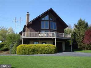 This contemporary A-frame  boasts spectacular panoramic views of Lancaster County farmlands; however, the never-ending sky steals the show!   Features of this one-of-a-kind gem include a gleaming hardwood floors throughout most of the home, a wood burning fireplace in the great room and a custom kitchen with a soapstone farm sink - just to name a few.   Current owners have meticulously cared for this property inside and out and recently installed a geothermal heating & cooling system, new skylights and roof,  as well as fresh paint and bathroom updates.  Property also includes a separate one-car detached garage/workshop, a shed,  a gazebo with electric and manicured landscaping.