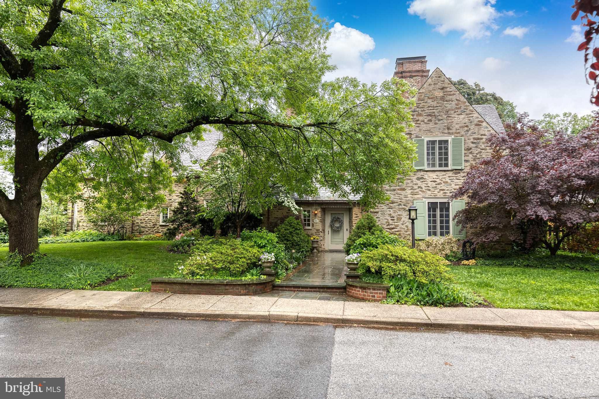 This architecturally unique stone home, designed by the renowned Palmer Lamdin Architects and built in 1928, offers a rare blend of timeless craftsmanship and modern luxury. With an expansive square footage and gracious room sizes, the home sits on an unusually large lot, spanning over half an acre, providing plenty of living space plus outdoor enjoyment. Boasting 5 true bedrooms, 4 full bathrooms, and 2 half baths, this residence offers the perfect balance of comfort and functionality. The home has undergone incredible renovations, with every bathroom beautifully redone, a stunning primary closet, and thoughtfully redesigned main living areas. These enhancements seamlessly combine historic charm with contemporary style. Step outside to experience a tranquil setting perfect for entertaining, where you can dine al fresco under the stone loggia while listening to the majestic bells of the Cathedral in the distance. The outdoor space, combined with the home’s graceful interior, creates a harmonious atmosphere for both relaxation and entertaining. Modern conveniences abound, including an attached garage accessible from the interior, a large driveway, a practical mudroom, two laundry rooms, and a finished basement. This residence not only preserves the character of its original design but also caters to today’s needs, making it an extraordinary home for those who appreciate both history and modern luxury.