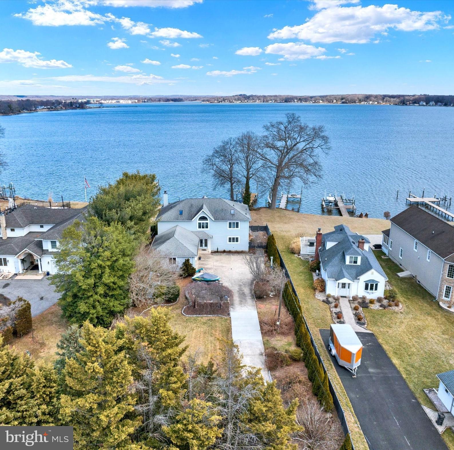 Presenting 317 Kennard Ave. a wonderful waterfront residence complemented by breathtaking panoramic views of the Bush River.  Gated driveway, privacy fencing, 3 car side load garage with lovely landscaping to welcome you home.  Contemporary design with an overlook from the 2nd level allows for natural light throughout the main level.  The great room features new carpet, a fireplace w/pellet stove insert, and sliding doors leading to a massive cedar deck overlooking a beautiful backyard.  Gourmet kitchen with an Island, breakfast bar w/stools,  SSA's, kitchen table space, and a large dining room area off the kitchen with amazing views!  A new full bathroom and spacious laundry with door-to garages are also located on the first floor.  Walking up the lovely staircase to the 2nd level loft/office area you can't help enjoy all the wonderful natural light from all the large windows. The primary bedroom offers a private balcony, WIC,  and Spa bathroom.  Two additional bedrooms, one with a private deck, a full bathroom, and an overlook to the main level complete the 2nd level.  Large unfinished lower level, with basement exit, bathroom rough-in, and ready for living space or storage.  Private pressured treated deck, 2 boat lifts, 1 jet ski lift, all-electric. 1 jet dock for extra wide boats w/winch.  Jet dock cubes can be rearranged for different applications.  Minutes to Edgewood Marc Train Station, Aberdeen Proving Ground, walking distance to Flying Point Marina & Restaurant, and so much more.  This home is the ultimate retreat for those seeking serenity along the water with amazing views every day of the year.