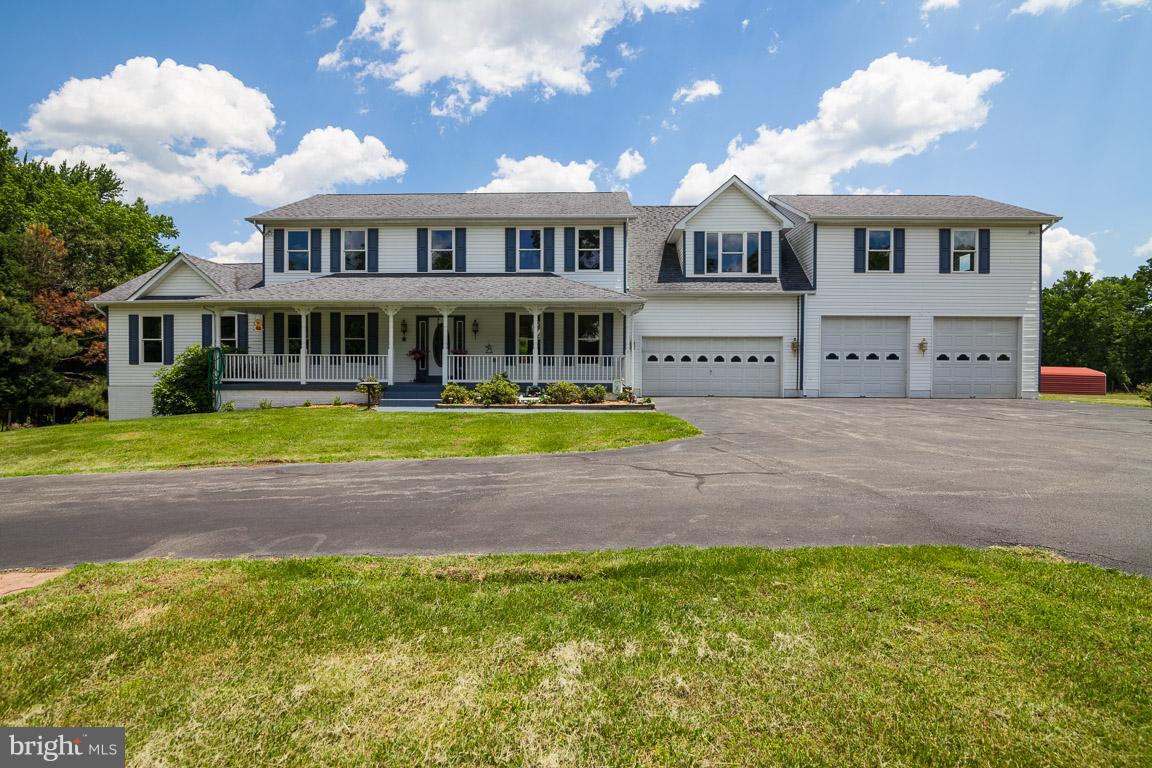 Mini Farm!! Over 4500 sq ft 5 BR and 4.5 Bath Colonial with 3 car garage situated on 11 acres!! Kitchen overlooks fam rm w/FP. Formal LR & DR perfect for entertaining. Office/Den off fam room. Open floor plan with updated ceramic floors and carpets in almost every room. Partially finished basement with full bath awaits your imagination. Property is zoned agricultural. A must see one of a kind!