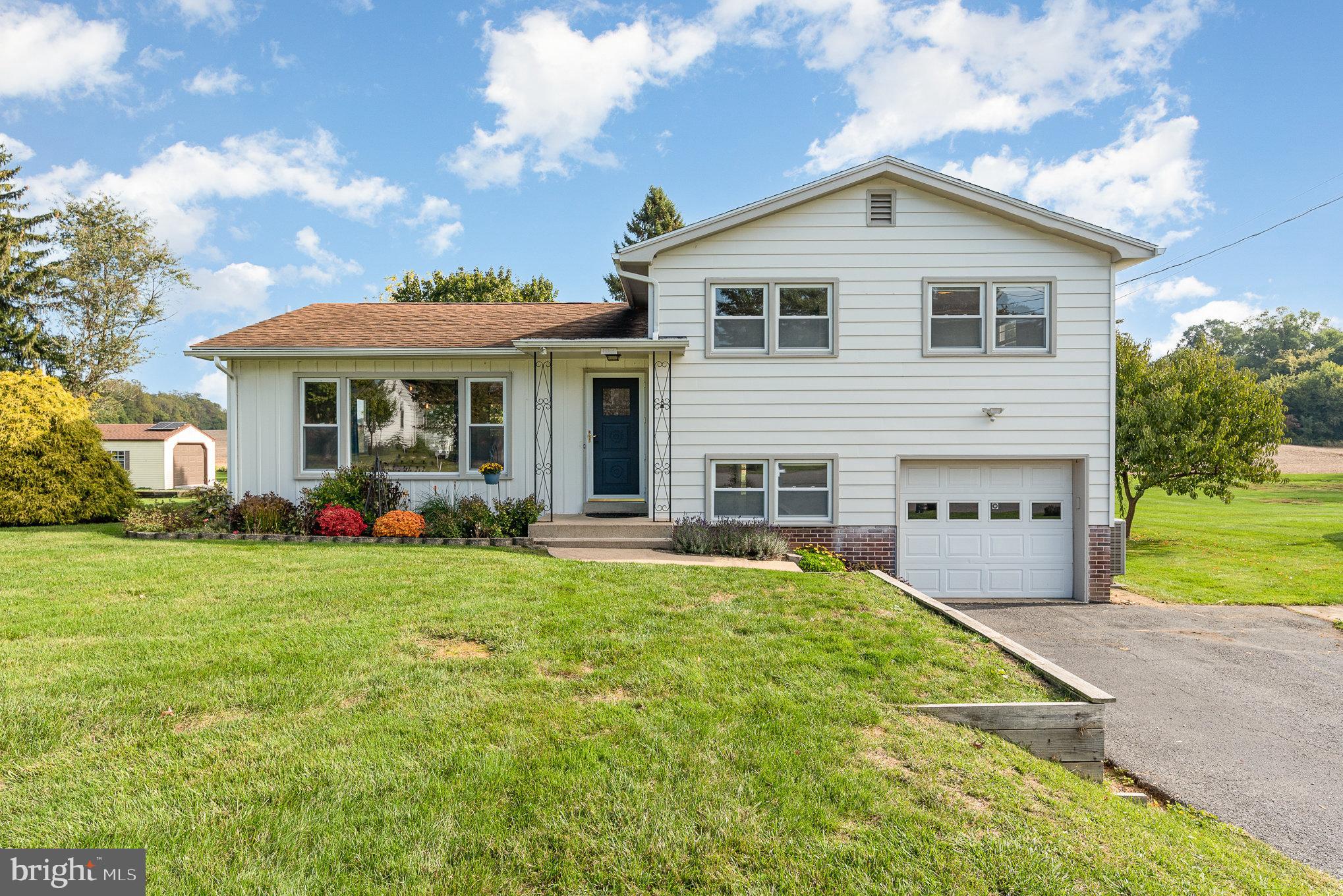 Back on the market... If you missed this great home in South Middleton Township the first time, here is your opportunity to jump on it now!!  Welcome to 103 Earl St. in Boiling Springs.  Nicely renovated home on quiet street in South Middleton Township. This adorable split level is located within walking distance to the school and to Children's Lake!  The home features 3 bedrooms and 1 full bath on the upper level with newer carpeting and a beautifully upgraded full bathroom.  The cozy main floor has an open floor concept with lots of natural lighting pouring in. The back door opens to a large and private backyard that backs to a corn field with beautiful views  The lower level offers additional living space great for a second family room or game room. Garage has been converted into even more  living space, but could be converted back.  Lower level also has conveniently located half bath and laundry room. Don't miss this opportunity to call this home your very own.
