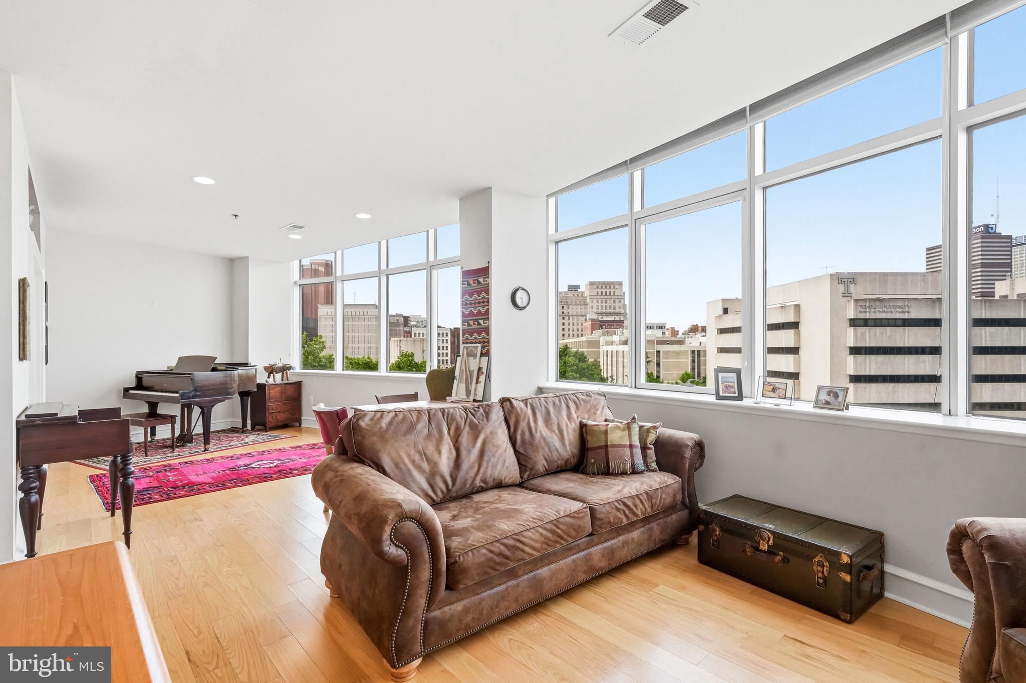 Welcome to this beautiful one-bedroom, one-bath residence in the highly desirable Metro Club. This thoughtfully designed unit features sweeping southwest facing views of the skyline, filling the space with natural light and stunning cityscapes throughout the day! This home showcases lovely hardwood flooring, fresh paint, and an inviting layout ideal for both relaxing and entertaining. An oversized laundry room offers plenty of extra storage and a custom-designed bedroom closet adds rare and practical convenience. Also included in the sale of this home is a deeded PARKING SPOT in a gated lot. BRAND NEW HOT WATER HEATER (December 2025) and HVAC maintenance (December 2025). Just outside the walls of this beautiful home you will have access to all the amenities that the building offers. The Metro Club has 24 hour concierge service, Amazon package locker hub, grab and go snack market, bike storage, gym, pool, cabanas, hot tub, bbq grills and fire pit. It is also a dog/cat friendly community! Located just across the street from Franklin Sq. Park and new Patco station. The Metro Club is just blocks away from Old City’s boutiques and cafes, with quick access to 676, 95, 76 and The Ben Franklin Bridge. Make your appointment today-this is the one!