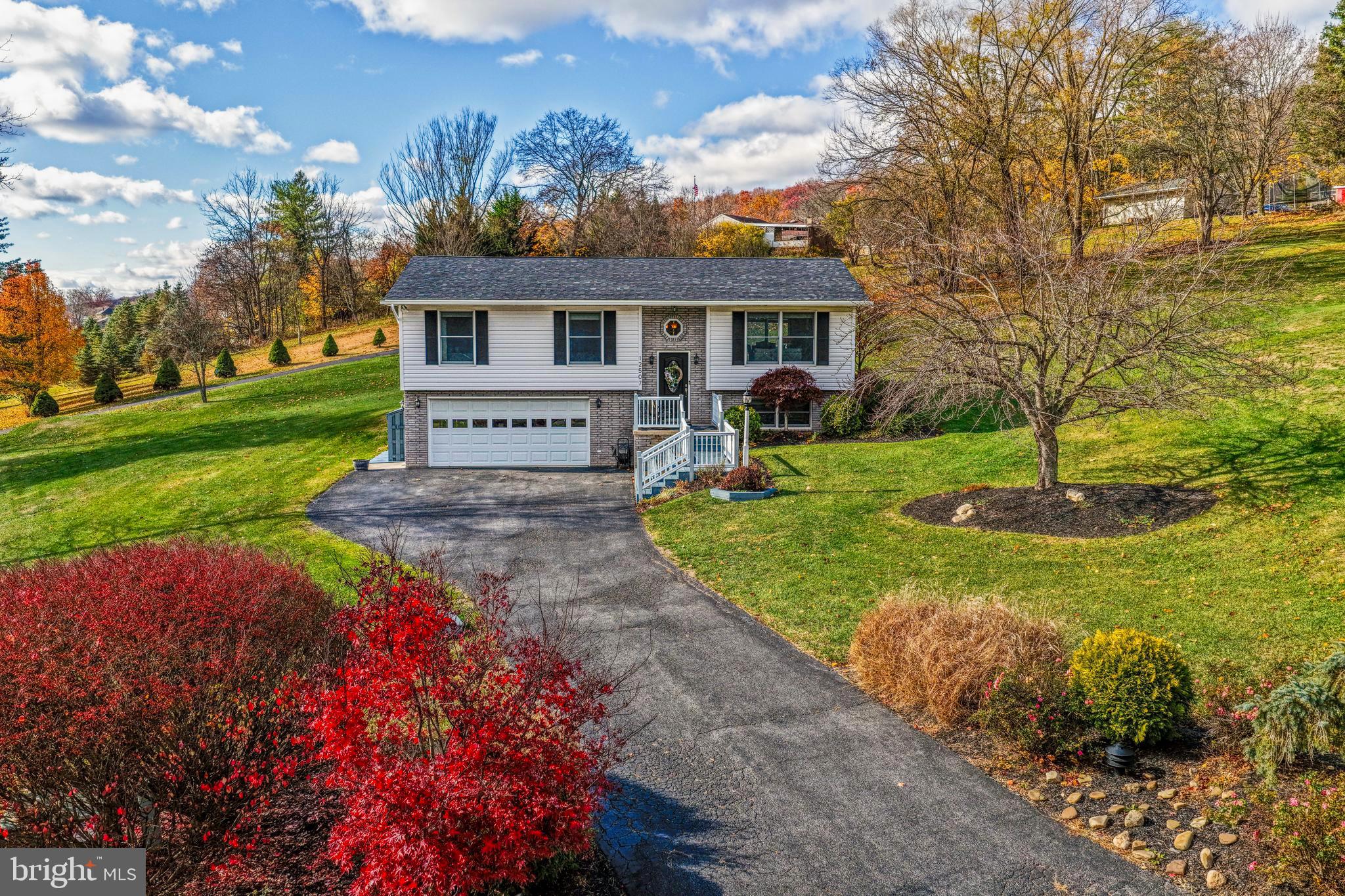 A Rare Find nestled in the beautiful mountains of Western Maryland, this stunning home is a must-see! Boasting 3 bedrooms, 3 bathrooms with owners ensuite,  this home offers 1,569 sq ft of thoughtfully designed living living space, step past the inviting entryway into an open-concept layout featuring a living room, flowing seamlessly into the dining area and a well-equipped kitchen. Step out back to relax on the rear deck and take in peaceful, private, and great views.  The neighborhood offers plenty of privacy. Additional features include: forced air heatpump heating & central air, new roof in 2025,  professionally lanscaped, all appliances included, front porch with gorgeous mountain views. Attached 2-car garage and generous driveway for plenty of parking. This rare gem offers the perfect blend of comfort, convenience, and natural beauty — and it won’t last long. Call today to schedule your private tour!