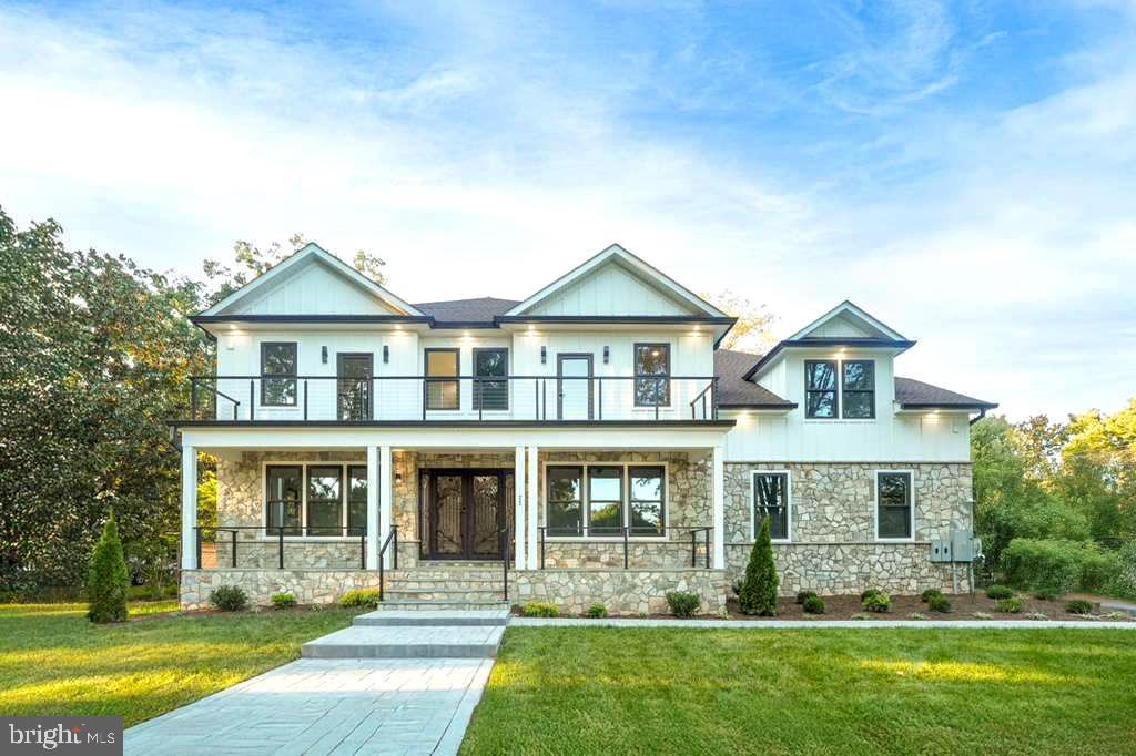 BRAND NEW CONSTRUCTION JUST FINISHED- MOTIVATED SELLER-  Discover this exquisite modern custom build contemporary new construction home, boasting over 6100 square feet of luxury on a flat .50-acre corner lot in heart of Fairfax City.  This residence features a side-load 2-car garage and an array of elegant amenities, including a main-level en-suite bedroom/office, four bedrooms upstairs, and another on the lower level. This home has an oversized 510 sq feet garage, 215 sq feet front stone porch, 182 sq ft second level deck and features 6 bedrooms/6.5 baths, providing ample space for a comfortable and luxurious lifestyle. This luxury estate home offers an unparalleled blend of elegance and customization. Enter through the designer double front doors from the welcoming covered stone front porch and be greeted by a stunning 2-story foyer. The main floor impresses with formal living and dining rooms, a chef's gourmet kitchen equipped with high-end Thermador stainless steel appliances, a 11-foot center island with waterfall edge luxury quartz countertops and designer series maple cabinetry. The main level also includes an oversized Guest Suite with a private bath perfect for a weekend guest but designed to support full time living. Second floor owner’s Suite – Private retreat with a Boxed Ceiling, two Walk-In Closets, and a luxurious bath with quartz countertops, freestanding tub and shower. Master bathroom also has a separate morning room and loft area for owner’s convenience. Every bedroom has private En-Suit baths, with walk-in closets. Two bedrooms also have attached morning/sitting/Loft areas, perfect for a home office, playroom, or retreat. Lower Level is fully finished with a Recreation Room, Bar, Exercise Room and additional Bedroom with Full Bath. This remarkable home is equipped with dual-zone Carrier HVAC systems, a 75-gallon electric water heater, PVC exterior trim, 30-year shingles, and combination of stones and Hardie board siding, ensuring style and durability. The home's design is elegant and modern, featuring a modern transitional exterior from stone to Hardy Planks. The construction of this property is of the highest standards, including 9 ft ceilings on all levels, exquisite modern moldings with custom LED lighting, wide plank oak hardwood floors, custom porcelain tile in every bathroom, and Kohler toilets. The house also features modern handrails, black windows, LED ambient lighting, tray ceilings in the family room, custom cabinetry in every bathroom, and an EV outlet in the garage. The location offers easy access to amenities, major highways, and metro stations, providing a connected lifestyle without compromising luxury. Interested buyers are encouraged to contact the listing agent to schedule a meeting with the builder.