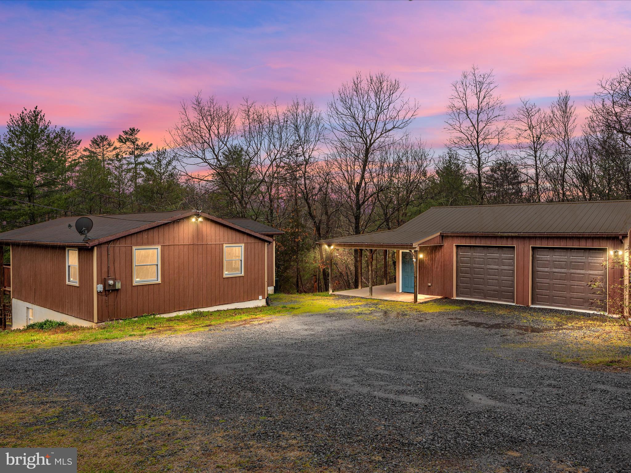 Escape to the peace and tranquility of this rustic lakefront cabin in Cherry Run! Nestled on 1.89 acres, this property offers a serene, wooded setting that feels like a private retreat.
Featuring 3 bedrooms and 2 baths with a family room that opens to a huge covered porch overlooking the lake. Two bedrooms are conveniently located on the main level, while the basement boasts a primary suite complete with a full bathroom and a spacious walk-in closet. The basement also provides flexible space for an office, hobby room, or workout area.
The home is equipped with a newer HVAC system installed in 2023, ensuring comfort throughout the seasons.
Step outside to enjoy breathtaking views of the lake, perfect for fishing and canoeing. The fenced backyard and lower patio area offer a picturesque setting for relaxing or outdoor gatherings.

Additional highlights include a detached garage(24x32) with a metal roof and a separate electric panel. 
Perfect for a workshop!

Whether you're seeking a weekend getaway or a permanent residence, this cabin offers the perfect blend of comfort and convenience. Located near The Woods Resort, you'll have easy access to a variety of outdoor activities and amenities. Schedule your showing today!
