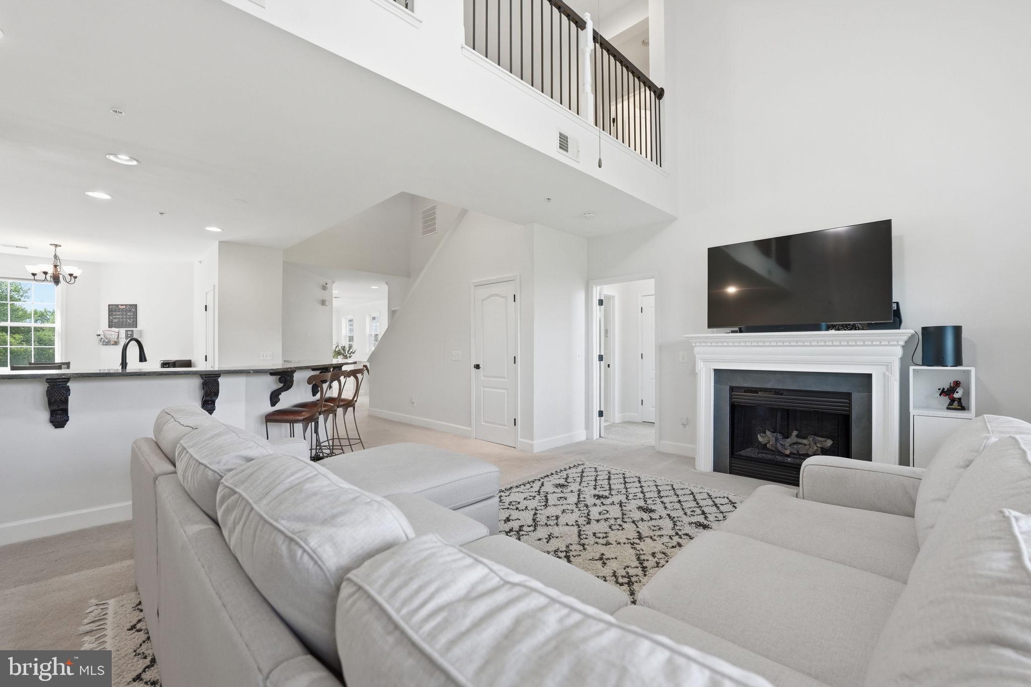 Welcome to Belmont Bay, where lifestyle, comfort, and charm come together. This beautifully updated townhome has been meticulously maintained and thoughtfully refreshed, offering the perfect blend of modern updates and inviting spaces. The open interior features vaulted ceilings, four spacious bedrooms, and a versatile loft area that can easily serve as a fifth bedroom, home office, fitness space, library, or creative studio. The primary suite offers a completely renovated bathroom with a stunning tiled walk-in shower, creating a relaxing retreat at the end of the day.  The updated kitchen showcases stainless-steel appliances and flows comfortably into the living spaces, making it perfect for everyday living or entertaining.  Start your mornings with coffee on the private balcony overlooking mature trees, green space, and scenic walking paths, offering a peaceful setting just outside your door.  Living in Belmont Bay means enjoying a vibrant waterfront community only minutes from the VRE for convenient commuting. Residents enjoy tree-lined streets, charming architecture, local shops,  and summer concerts and community events that bring neighbors together.  The community swimming pool is included in the HOA/Condo fee, offering the perfect place to cool off during Virginia’s warm summer days. Residents also have the option to join the Belmont Bay Marina, making it easy to enjoy boating and waterfront living.
Additional recent updates include:
• HVAC – only 1 year old
• Water heater – only 1 year old
• Renovated kitchen, bathrooms, and laundry room
Come experience Belmont Bay living,  you may never want to leave.