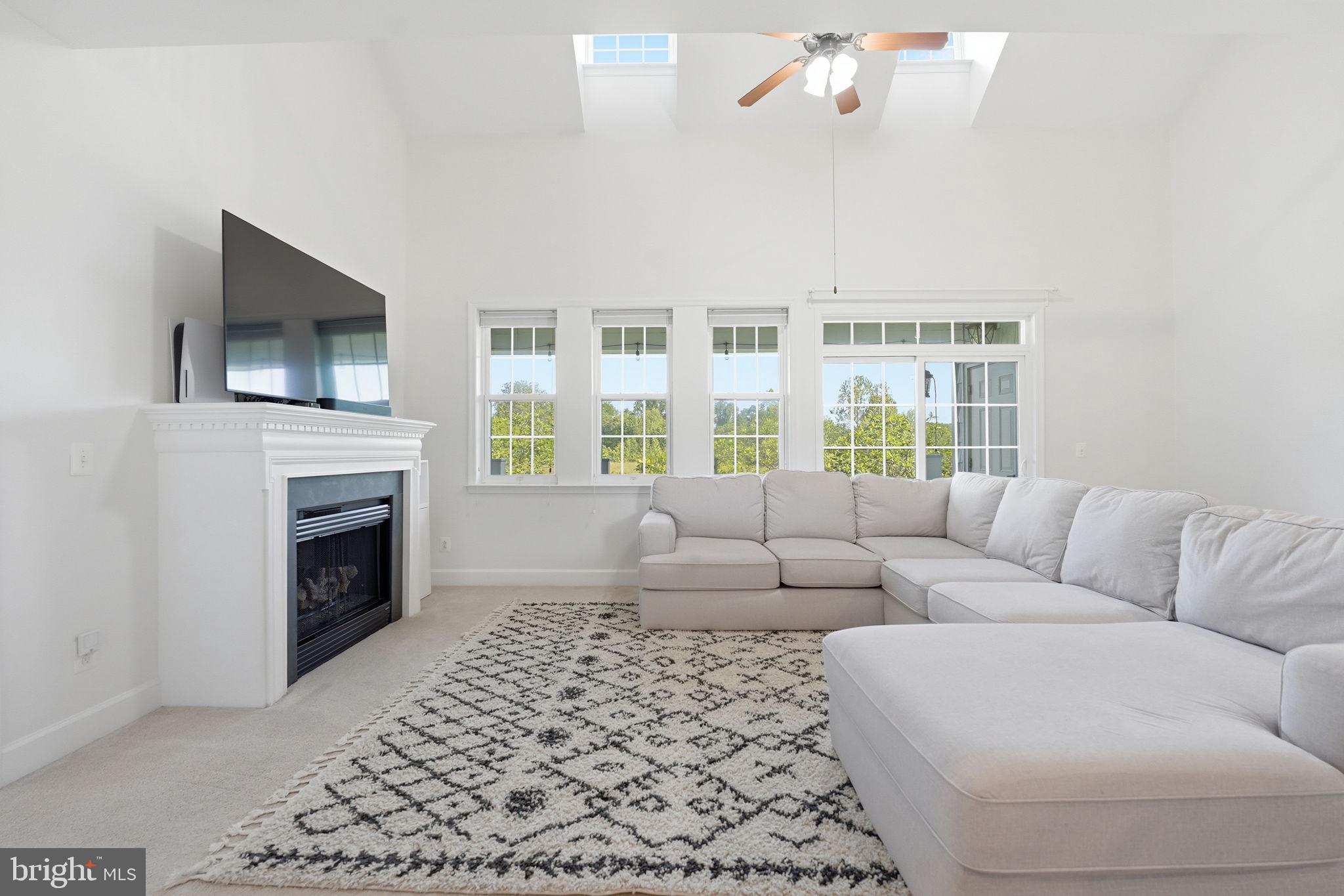 Welcome to Belmont Bay, where lifestyle, comfort, and charm come together. This beautifully updated townhome has been meticulously maintained and thoughtfully refreshed, offering the perfect blend of modern updates and inviting spaces. The open interior features vaulted ceilings, four spacious bedrooms, and a versatile loft area that can easily serve as a fifth bedroom, home office, fitness space, library, or creative studio. The primary suite offers a completely renovated bathroom with a stunning tiled walk-in shower, creating a relaxing retreat at the end of the day.  The updated kitchen showcases stainless-steel appliances and flows comfortably into the living spaces, making it perfect for everyday living or entertaining.  Start your mornings with coffee on the private balcony overlooking mature trees, green space, and scenic walking paths, offering a peaceful setting just outside your door.  Living in Belmont Bay means enjoying a vibrant waterfront community only minutes from the VRE for convenient commuting. Residents enjoy tree-lined streets, charming architecture, local shops,  and summer concerts and community events that bring neighbors together.  The community swimming pool is included in the HOA/Condo fee, offering the perfect place to cool off during Virginia’s warm summer days. Residents also have the option to join the Belmont Bay Marina, making it easy to enjoy boating and waterfront living.
Additional recent updates include:
• HVAC – only 1 year old
• Water heater – only 1 year old
• Renovated kitchen, bathrooms, and laundry room
Come experience Belmont Bay living,  you may never want to leave.