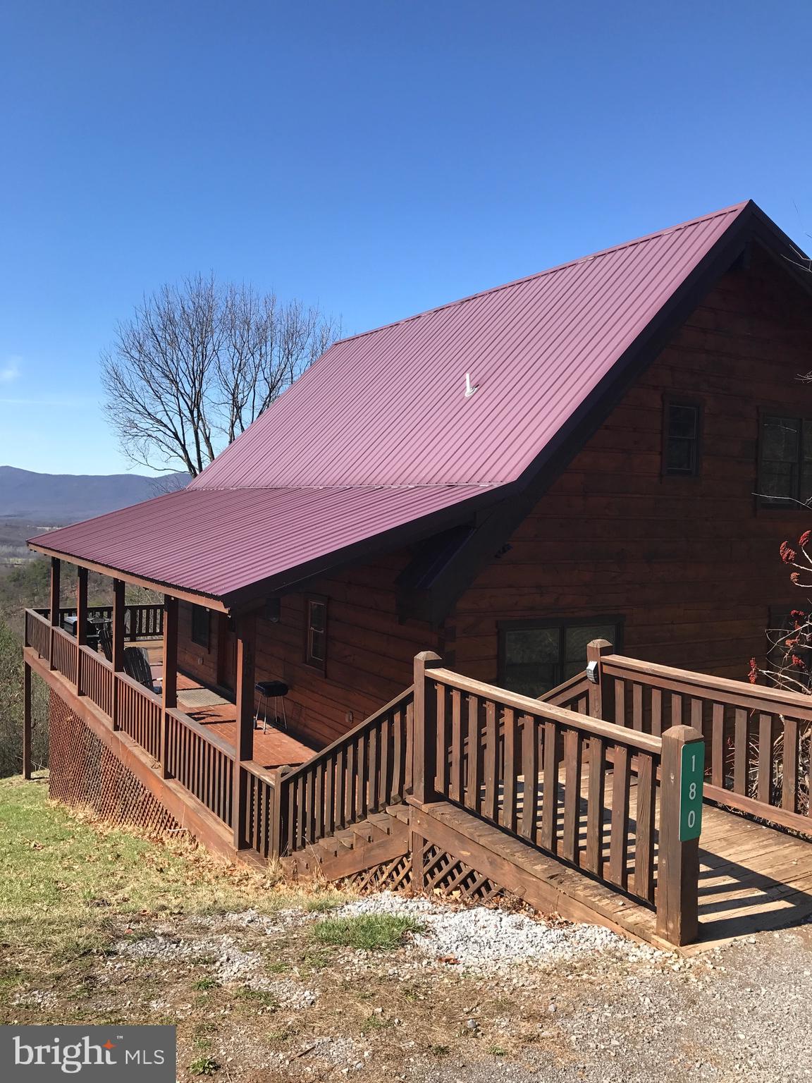 4 custom built log cabins, true log cabins with amazing views, you can see for 30 miles across the valley and to the mountains in the west, beautiful sunsets, close to the Shenandoah National Park, private mountain setting sits on 10.49 acres total tall ceilings with exposed beams, rock fireplace hardwood floors, granite counters and stainless appliances, indoor jacuzzi, outdoor hot tubs, has been a  short term rental cabins 
sale includes all furnishings everything to start your own short term rentals, live in one and rent others out or rent all four

Possible owner finanacing with 25% down  rate lower than commercial rate