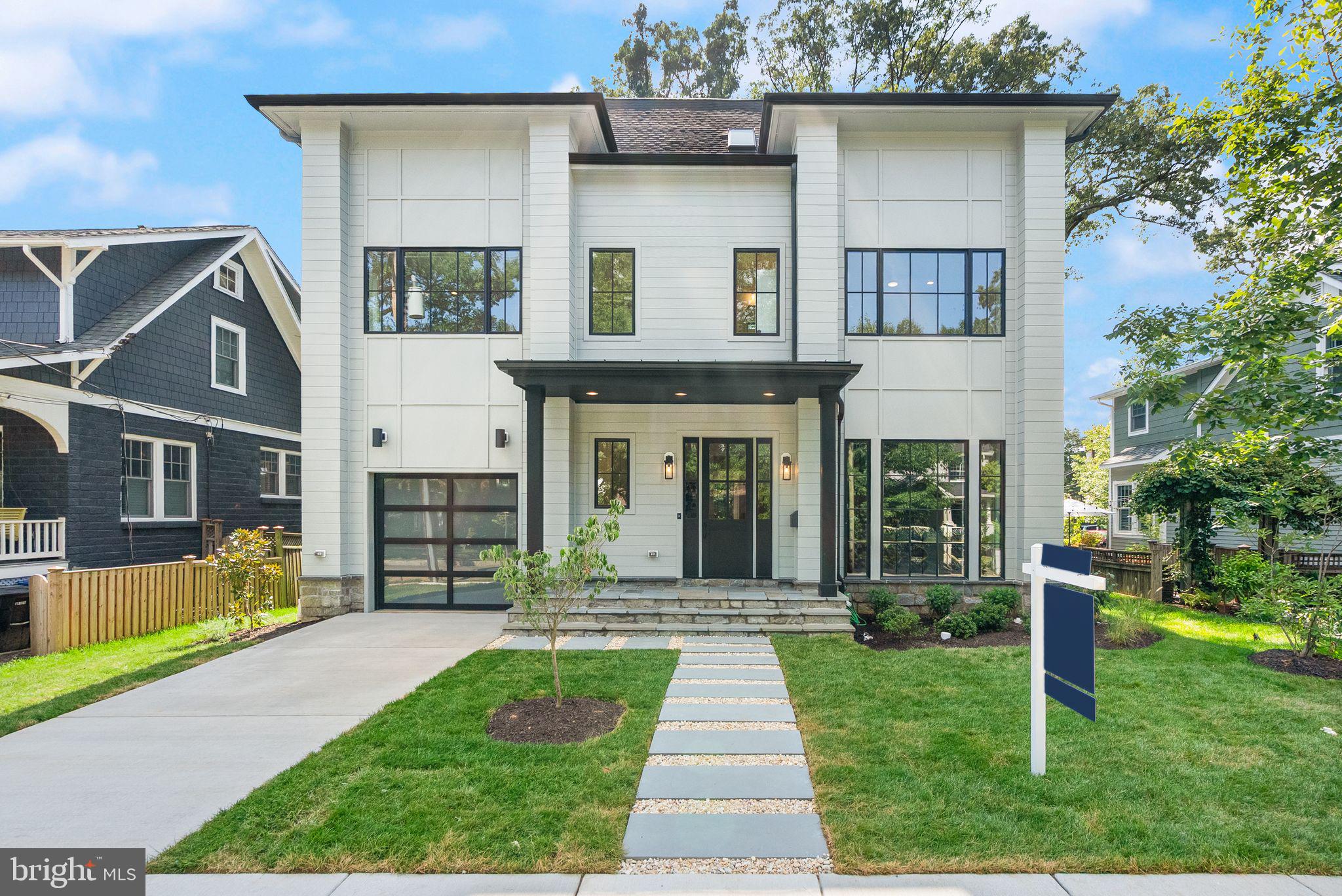 PRICE REDUCED!!!  Stunning New Construction in Lyon Park -  a COMMUTER’S DREAM and entertainer’s paradise! This 6 bedroom, 6.5 bathroom home offers 6,000+ sqft across four levels with a thoughtful floor plan and luxury finishes throughout. Highlights include a chef’s kitchen with Wolf/SubZero appliances, open-concept living, hardwood floors, custom cabinetry, and a private backyard deck. The top-level loft features a custom wet bar and a removed secondary bedroom with a full bathroom, while the fully finished basement includes another wet bar, gym, additional guest suite. The spa-like primary suite boasts dual walk-in closets, floating vanities, and heated floors. The location is unbeatable, blocks to parks, shops, and dining and under 1 mile to Clarendon and 1.5 to Ballston. Quick access to Rt. 50, I-66, I-395, Pentagon, Crystal City, and DC - all within 10 minutes. Just 5 miles to DCA. Zoned for Long Branch ES, Jefferson MS, and Washington-Liberty HS.