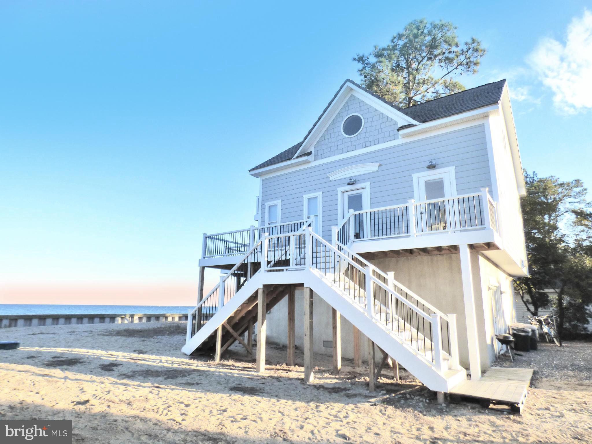 Beach front Ber Na Mara has been taken down to the studs & totally rebuilt in luxury.  Top shelf offers an amazing private MA suite with it's own deck and bath. Main level has two BR's and a full ba w/ upgraded kitchen & living room w/ sliders & expansive decking  for optimum Chesapeake Bay & beach viewing.  Base level has 2nd MA BR w/ full BA & rec room with 1/2 bath.  Only 2 hrs from DC.