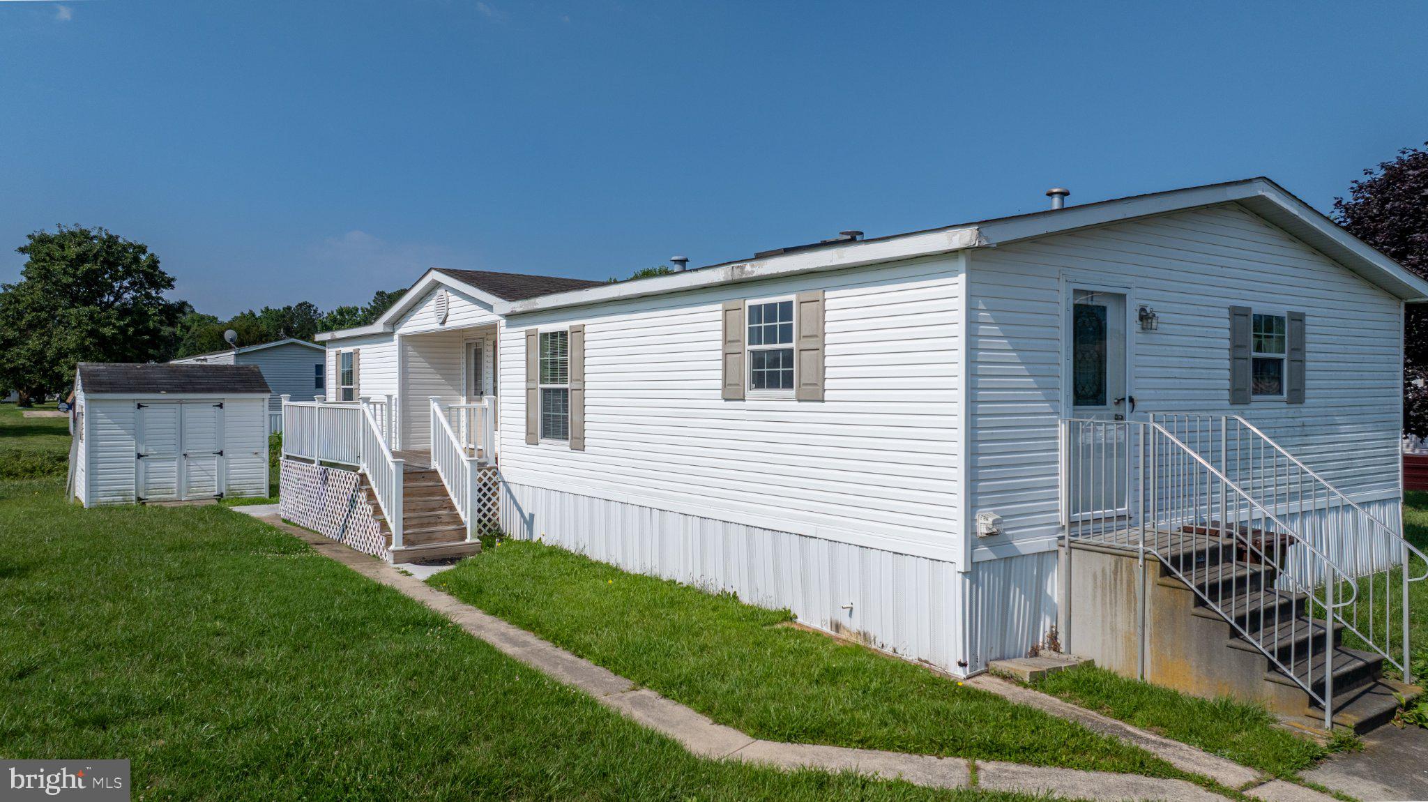 Welcome to this well-maintained 3-bedroom, 2-bath home located in the highly desirable Strawberry Village Mobile Home Park, just minutes from Ocean City and all the beaches, shopping, dining, and entertainment the area has to offer. Inside, you'll find a spacious and inviting layout filled with natural light from an abundance of windows. The generous primary suite offers a private retreat with a relaxing soaking tub, separate walk-in shower, and plenty of space to unwind. The kitchen features ample counter space, making meal preparation and entertaining a breeze, while the cozy fireplace creates a warm and welcoming focal point in the living area. Step outside to enjoy the large deck, perfect for relaxing or hosting gatherings, along with the convenience of an outdoor storage shed for all your extra storage needs. Whether you're looking for a primary residence or a coastal getaway, this home offers comfort, convenience, and an excellent location close to everything Ocean City has to offer.