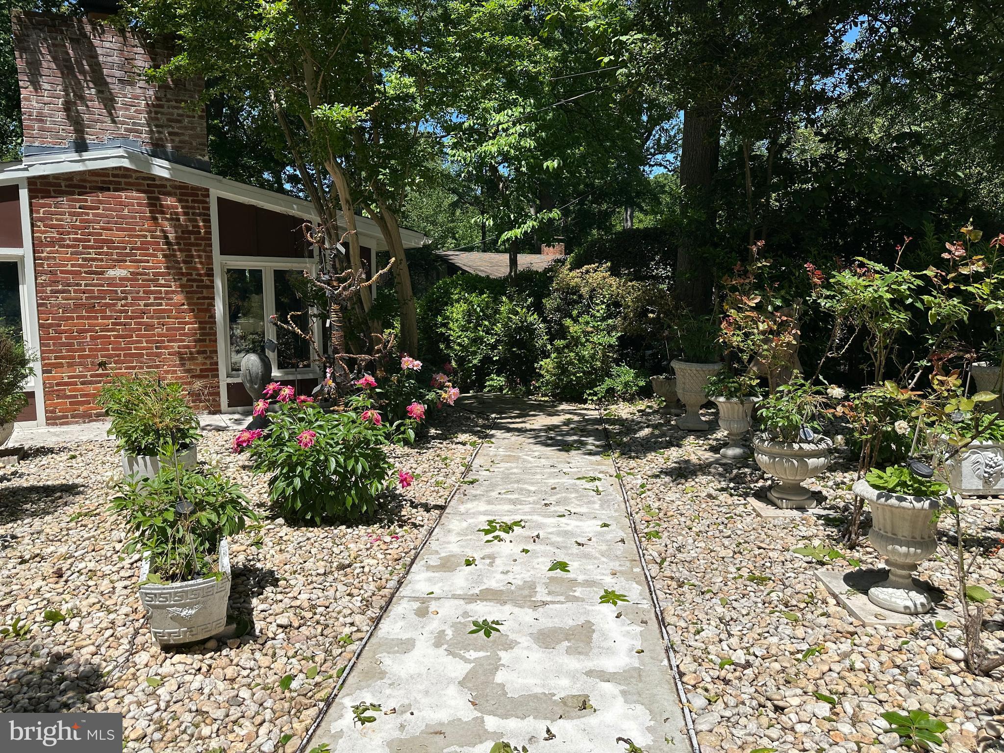 Beautifully renovated 2-bedroom, 2-bathroom lower-level unit in Glen Echo Heights, featuring a fully equipped kitchen, living and dining areas, soaring windows, outdoor green space, and complete separation from the upstairs unit.