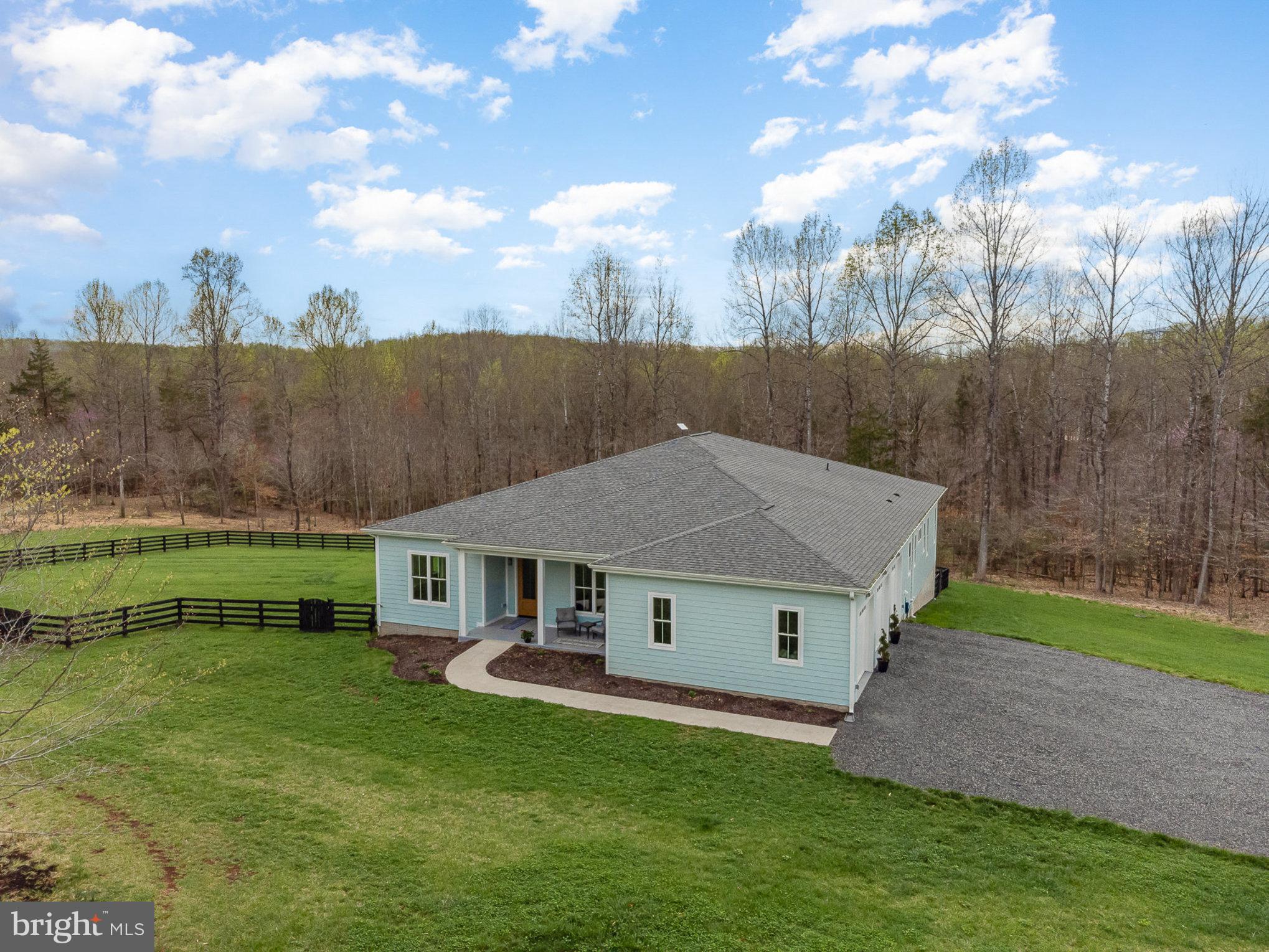 One level living located in beautiful Ashbourne Farms.  This 2-year old home located in the majestic area of Rixeyville, Virginia sits on 11.5 acres.  Solid Hard Maplewood flooring throughout the home, plus 10' ceilings make this oasis...so light and breezy...almost coastal.  This hidden gem's bedroom at the front can be used as an office with its double doors.  It sits alongside a half-bath, then a very sizable, 2nd bedroom...plus full bath.  Both rooms have automatic blinds.  Enter into the open & airy living space which was made for entertaining.  The gourmet kitchen is amazing with gleaming stainless appliances alongside Silestone Quartz countertops,  and a  5-burner gas cooktop, plus huge kitchen island.  Has easy to clean high-end cabinetry w/ lots of modern drawers.  The new (almost 500 sf) screened porch off the living/dining area is an extension of the home adding views of wildlife and stunning scenery.   Sizeable Master Suite is located on the opposite side of this Open Concept home.  It is the most luxurious room in the house along with a tray ceiling and Plantation Blinds.  The owner's shower is oversized, also handicap accessible.  The Laundry/Mud Room has lots of built-in features and is conveniently located just outside the bath plus a door that goes out front...these great features are designed for aging in place, along with 36" doors throughout the home!  Some other features of this well-built home are:  Instant hot water heater, whole house wired-in generator (22kw) with warranty, custom hand-blown glass pendants at the kitchen island, as well as a beautiful handmade fixture (Bicycle Co.) in the foyer, automatic window blinds in bedrooms & screened porch, Trex decking.  Horse fencing (w/ screen) was added to one-half acre so ready for your dogs.  Bring all your animals, build your barn and outbuildings, no HOA here.  This gorgeous property gently slopes down to a creek. See our drone coverage!  The exterior walls of this home, built by a local Artesian, have 2' X 6 ' outer walls!  The "crawlspace" is a 100% waterproof Walk-In, completely covered throughout, plus climate controlled (think storage!)  Nothing has been left out here.  This is not a cookie cutter property, but well thought through.  The devil is in the details.  This is the most lovely, private, and one of a kind home built for your dream come true!