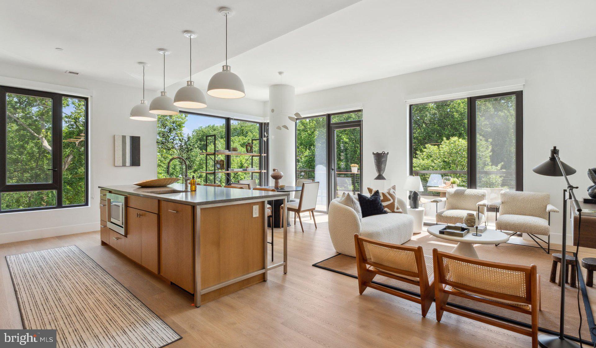 Welcome to your brand-new home at Ravel and Royale, where every detail reflects 2024 construction quality and modern design sensibility. This expansive two-bedroom, two-bathroom residence spans 1277 square feet of thoughtfully designed living space that has never been occupied. Step through your front door onto beautiful wood floors that flow seamlessly throughout the open floor plan, creating an airy canvas for your daily life.

The heart of your home centers around a stunning kitchen where upgraded countertops provide the perfect workspace for morning coffee preparation and evening meal creation. Stainless steel appliances gleam against the contemporary backdrop, including a full suite of modern conveniences. The refrigerator with ice maker ensures cold beverages are always at hand, while the self-cleaning oven and range hood make cooking and cleanup effortless. Your dishwasher, disposal, and microwave complete this culinary haven where you can picture yourself preparing everything from quick weekday breakfasts to elaborate weekend dinners.

Your entry level bedroom offers immediate convenience, while generous walk-in closets throughout provide abundant storage for your wardrobe and belongings. Ceiling fans in every room ensure year-round comfort, and your in-unit washer and dryer eliminate trips to communal laundry facilities. Both full bathrooms reflect the same attention to quality and detail found throughout your residence.

Beyond your front door, Ravel and Royale elevates daily living with resort-style amenities designed for every lifestyle. Start your morning with a workout in the fitness center, then perhaps take advantage of the jogging path for outdoor cardio. The gated community provides peace of mind, while elevator access ensures convenience to your floor. Your concierge stands ready to assist with daily needs, from accepting packages to providing local recommendations.

When work calls for meetings or presentations, the on-site meeting room offers professional space without leaving home. Game room entertainment provides options for relaxing evenings, while the picnic area creates perfect settings for outdoor dining. Your four-legged family members will appreciate the dedicated dog park, and the community welcomes both cats and dogs with a required deposit.

Perhaps most impressive is the stunning roof deck where you can unwind each evening, watching the sun set over North Bethesda while planning your next adventure in this vibrant neighborhood. The area offers an enticing mix of walkable dining and shopping experiences, from cozy cafes perfect for weekend brunches to diverse eateries representing cuisines from around the world. The eclectic blend of established favorites and exciting new establishments along the local corridor means discovering your next favorite restaurant is always just a short stroll away.

Your garage parking ensures your vehicle stays protected from the elements while providing the security and convenience you deserve. The community pool beckons during warmer months, offering a refreshing escape just steps from your door. Enhanced security features throughout the building provide additional peace of mind in your new home.

This exceptional residence at 10511 Strathmore Hall Street becomes available May 23rd, 2026, offering you the opportunity to be among the first to call this remarkable community home. Pricing and availability subject to change on a daily basis. Photos are of model units. Parking may be available subject to availability and may be an additional fee.
