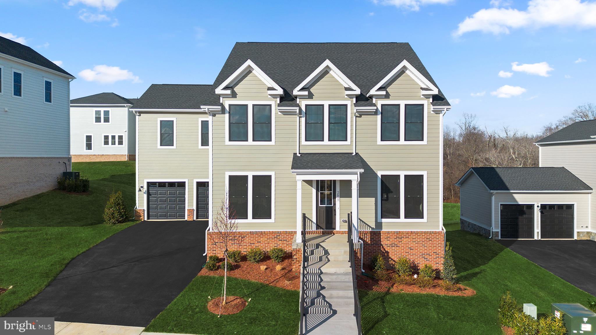 Welcome to Heritage at Marshall, an impressive master-planned community nestled in the foothills of the Blue Ridge Mountains. Life’s simple pleasures are elevated in this thoughtfully designed home, where comfort and style meet in a functional, open-concept floorplan. The main level is designed for effortless living and entertaining,  featuring a seamless flow between the living, dining, and kitchen areas. A private study offers the perfect space for working from home, reading, or quiet reflection, while the home’s inviting retreat provides a peaceful place to relax and unwind. The designer kitchen is both stylish and highly functional, showcasing GE® stainless steel electric appliances, including a five-burner GE® cooktop with a sleek chimney hood and a GE® smart single convection wall oven. A Kohler® stainless steel undermount sink is paired with elegant white soft-close cabinetry accented by satin nickel hardware, an upgraded white backsplash, and striking dark grey soapstone quartz countertops. Upstairs, the spacious primary suite offers a serene escape with a spa-inspired bathroom featuring Kohler Hint® vibrant brushed nickel fixtures, dual vanities with white soft-close cabinetry and satin nickel hardware, and sophisticated dark grey soapstone quartz countertops. The frameless glass shower enclosure is highlighted by beautiful white floor-to-ceiling tile, creating a bright and luxurious atmosphere. Both the primary and secondary bedrooms include generous walk-in closets, enhancing comfort and organization for everyone in the home. Stylish flooring runs throughout, with durable Luxury Vinyl Plank (LVP) in the main living areas and plush, wall-to-wall stain-resistant carpeting in all bedrooms for added warmth and comfort. This home blends modern design, high-quality finishes, and everyday functionality to create a living experience that feels both elevated and welcoming. Heritage at Marshall is ideally situated in downtown Marshall, with Main Street just a leisurely stroll away and excellent schools conveniently nearby. Embodying the essence of premier living in Fauquier County, the neighborhood grants residents access to a host of amenities, including open green spaces with walking and jogging trails, a picturesque outdoor swimming pool, serene ponds and nature areas, a welcoming community clubhouse, and a fun-filled tot lot with an outdoor playset. Experience the perfect harmony of modern living and timeless natural beauty at Heritage at Marshall, a true sanctuary that strengthens the community for generations to come.