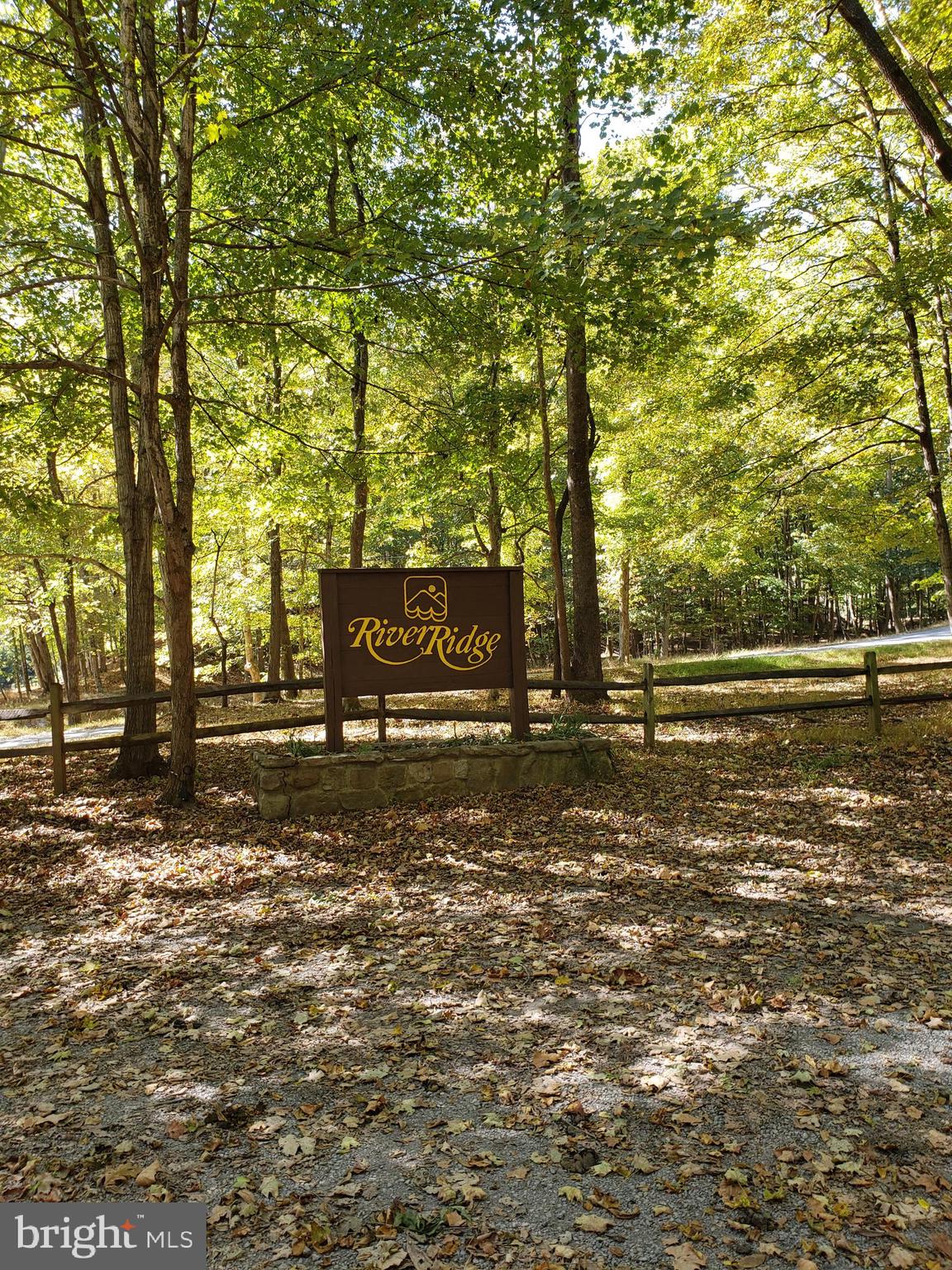 Enjoy the peace of mind in this private gated community located along the Cacapon River.  The lot is wooded and ready for you to build your retreat home, or full time residence.  Only about 12 miles west of the Historic town of Berkeley Springs, WV, the countries first spa.  This lot has a 3 bedroom septic permit on file with the Morgan County Health Dept.. Come enjoy the mountains and the community access to the Cacapon River with a bathhouse, area to leave your water craft locked up and nice stone grills and picnic tables.  You are allowed to have an ATV to drive around the community and down to the river area.  You are also allowed to put your home on a short term rental program if you so desire.  Come visit this mountain community. Great area for calling your own Mountain Retreat.  Camping on your property may be permitted with HOA approval.  Great area to live in.