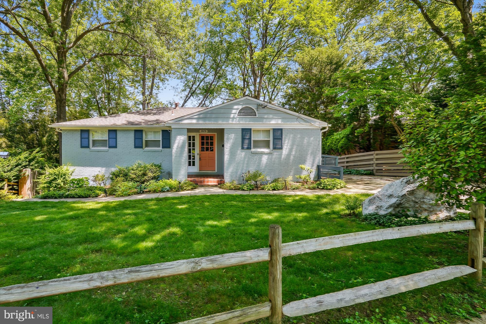 This 4BR/3BA mid century ranch features an open concept upgraded kitchen, dining, and family room.

Exposed brick adds interesting detail while two sliding glass doors and a picture window provide plenty of light and views of the beautiful trees. The deck is the perfect hangout spot for friends and family. The kitchen features upgraded stainless steel appliances. The main level also features a sunroom that is soundproof, offering some privacy and a perfect space for working from home along with a beautiful view. Also on the main floor are three bedrooms and two bathrooms. The primary bedroom features an ensuite bathroom with shower.

The basement offers even more square footage, including a large rec room and an additional bedroom and full bathroom! A spacious laundry room area can double as a storage space. From the rec room, double sliding glass doors open onto a sizeable patio that's perfect for entertaining and play in a private, fenced in yard.

This lovely home offers square footage rare and great location, with easy access to Kensington, Bethesda, and Rockville. You won't want to miss out on this opportunity!