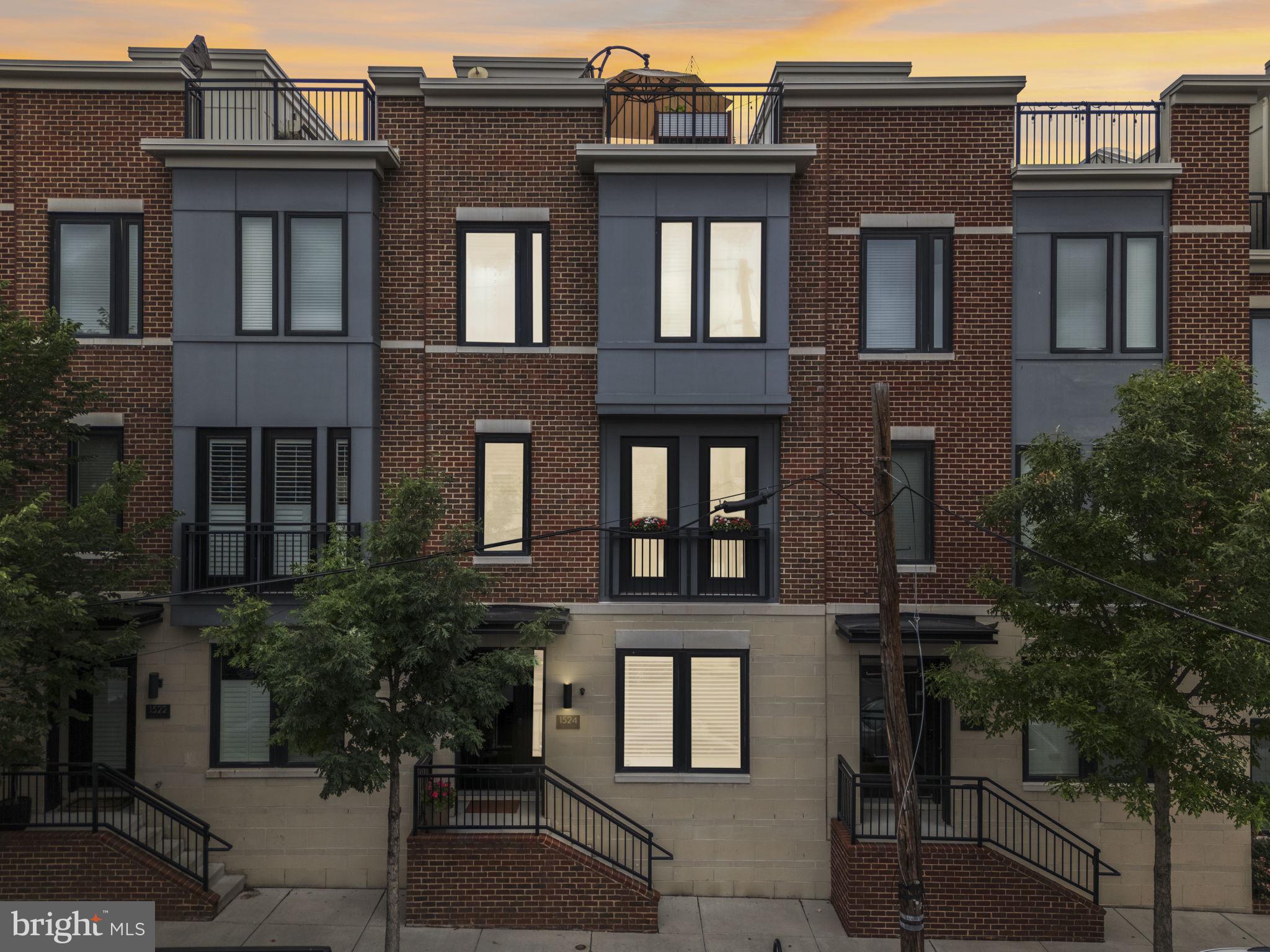Welcome to 1524 Beason Street! This beautifully upgraded ALTA47 home with a two-car garage offers the perfect blend of modern design, functionality, and city living in the heart of Locust Point, Baltimore!  Inside, you’ll find a thoughtfully designed layout featuring three spacious bedrooms and two full bathrooms upstairs, along with an additional flex space on the entry level complete with French doors - perfect for a home office, gym, guest room, or second living space. A convenient half bathroom on the main living level adds even more functionality for everyday living and entertaining. The true centerpiece of the home is the one-of-a-kind gourmet kitchen, upgraded beyond others in the community with custom cabinetry and premium KitchenAid appliances. The open-concept main floor flows beautifully into the dining and living spaces, highlighted by custom built-ins, a striking exposed brick tile fireplace feature, under-cabinet lighting, and plantation shutters throughout. This home is packed with thoughtful upgrades, including: Epoxy garage floors, Lutron smart switches, Whole-home WiFi with ethernet backhaul, Ecobee thermostat, Ring doorbell + Schlage smart lock, EV charger in garage, Ceiling fans in all bedrooms and rec room, Garage ceiling storage, Roof deck rough-ins for speakers, wet bar, and gas fireplace, Bistro string lights on the rooftop deck, Flower boxes on the Juliet balcony. Enjoy relaxing or entertaining on the private rooftop deck with beautiful city views. Or, enjoy access to the courtyard for ground-level activities with your neighbors and extra off-street parking. With approximately two years remaining on its tax credit, you’ll enjoy significant annual savings, making this stunning home even more attractive and affordable. Located just minutes from Federal Hill, Canton, the Inner Harbor, I-95, restaurants, parks, and shopping, this home offers the best of both convenience and luxury living in one of Baltimore’s most sought-after neighborhoods. Don’t miss the opportunity to own this truly special home in Locust Point!