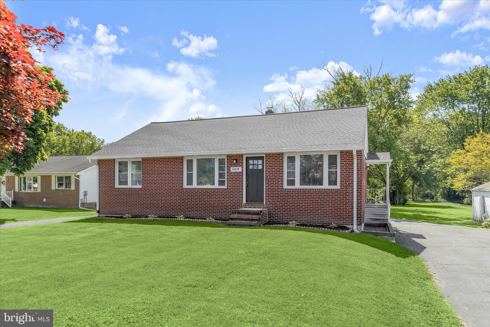 Introducing this fully updated four bedroom, two bathroom rancher-style home situated on over an acre backing to woods. Step inside to a welcoming front living room with refinished hardwood floors that continue into the separate dining room and throughout the main level. The kitchen features granite countertops, a subway tile backsplash, soft-close cabinets, stainless steel appliances, and a convenient door leading to the side porch and driveway. The main level offers three bedrooms and a full bathroom with a tiled tub shower. Downstairs, the fully finished lower level expands the living space with a massive recreation room and walk-out stairs outside. The fourth bedroom provides a private retreat away from the main level and can easily function as an office, den, or gym, complete with an attached full bathroom featuring a walk-in shower. A utility room with laundry and abundant storage adds to the home’s functionality. Outside, enjoy the expansive backyard with plenty of space for outdoor activities and endless potential to create your ideal outdoor living area.