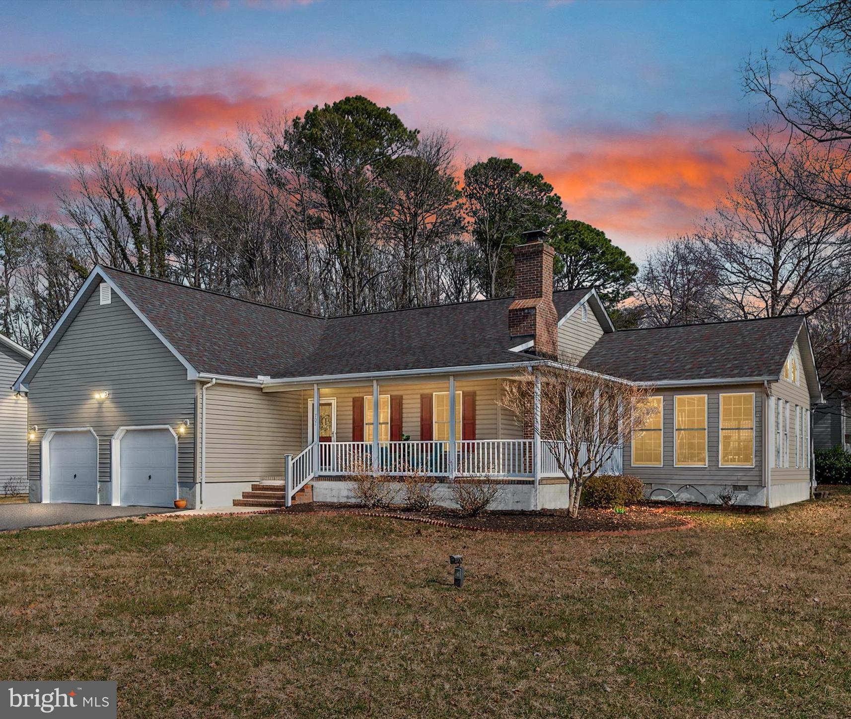 STUNNING WATERVIEW CORNER LOT in the desired Waterfront Community of BAY CITY!  Enjoy Sunsets over the Chesapeake Bay right from your very own wrap-around-porch... just bring your Rockers or Adirondack Chairs as the views are free!  Mature landscaping, trees, ample green space for gardening and brick paver walkways makes this an outdoor lovers dream! The sweet Zen Garden with the sitting bench under the Oak tree is the perfect spot to take in the fresh air of the Eastern Shore and the deck is the place to be for those Summer Crab Feasts!  This Custom Built Craftsman Style Rancher is solidly built with tons of natural light, cathedral ceilings and ready for you to move right in! The quality of construction is obvious as soon as you walk in the front door, you can feel it! All NEW Paint, extensive Crown Moldings and Trim, Gleaming Hardwood Floors and New Carpet in the 3 Bedrooms! The Primary En-Suite has a HUGE Walk-In Closet and its own access to the 3 Seasons room to enjoy morning coffee. Cozy up to the gas fireplace in the great room while reading a book from the built-ins or snuggle up to the 2nd fireplace in the sunken living room. The open floor plan, deck, porch and large lot allow for entertaining at its finest.  Spacious Kitchen with dining area, breakfast bar, Corian counters, Cherry cabinets and a large pantry. There is an oversized 2 Car Garage attached with extra storage room and separate entrance into the large mud room complete with Washer, Dryer, Utility tub, Whole-House Vaccuum and Closet. BONUS Dwelling with a separate paved Driveway, a Detached 1 Car Garage with pull down attic, Laundry Room, utility tub and a Finished Cottage! The Cottage living space boasts 2 Bedrooms, a full bath, Kitchen, Island, Living Room and French Doors leading to paved patio-  it is the PERFECT Place for an In-Law Suite , Au-Pair or Home Office.  This kind of property does not come on the market very often, so make your move today and start making UNFORGETTABLE MEMORIES HERE!!