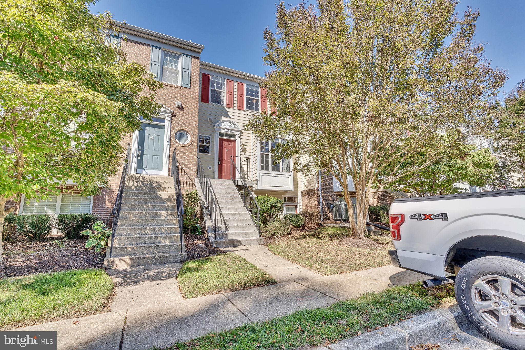 Charming, updated townhome in the desirable Crofton area featuring 3 bedrooms, 2.5 baths, and a private setting backing to woods. Enjoy a spacious living room with a cozy fireplace, an eat-in kitchen, and convenient laundry on the lower level with walkout access to a patio. The main level offers a deck perfect for relaxing outdoors. Includes 2 reserved parking spaces plus ample guest parking. Just a short walk to the community pool and ideally located near local conveniences!