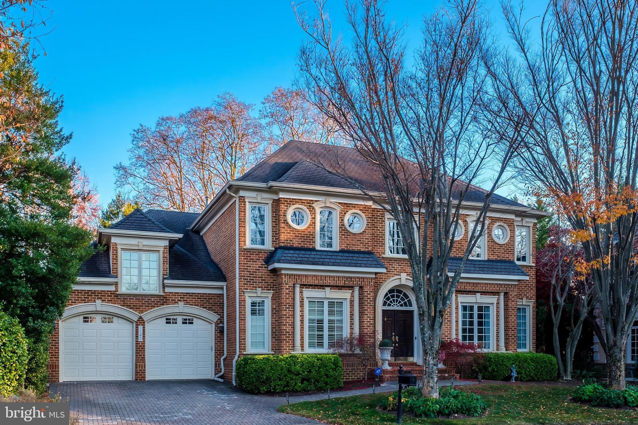 Welcome to 7422 Old Maple Square, a private gated enclave of timeless brick homes, perfectly situated inside the Beltway and close to premier shopping, top-rated schools, and scenic parks. This beautifully updated home boasts one of the most sought-after floor plans in the community, combining elegance and functionality.  Step into the grand two-story foyer leading into the spacious and light filled interior. With five bedrooms, 5.5 baths, and soaring ceilings, this home offers both luxury and comfort. The main level features a highly desirable first-floor owner's suite, ensuring convenience and privacy. The open floor plan flows seamlessly to a newly built walkout deck, perfect for relaxing or entertaining.  Upstairs, you’ll find three additional bedrooms and two baths, ideal for family or guests. The lower level is a versatile space, functioning as an independent suite with a bedroom, full bath, kitchen, and direct access to the rear yard. Completing this exceptional home is a two-car garage and thoughtful updates throughout. Just minutes to Tysons, 495 and I-66. This lovely neighborhood fosters a warm sense of community and the HOA takes care of everything to make life easier.