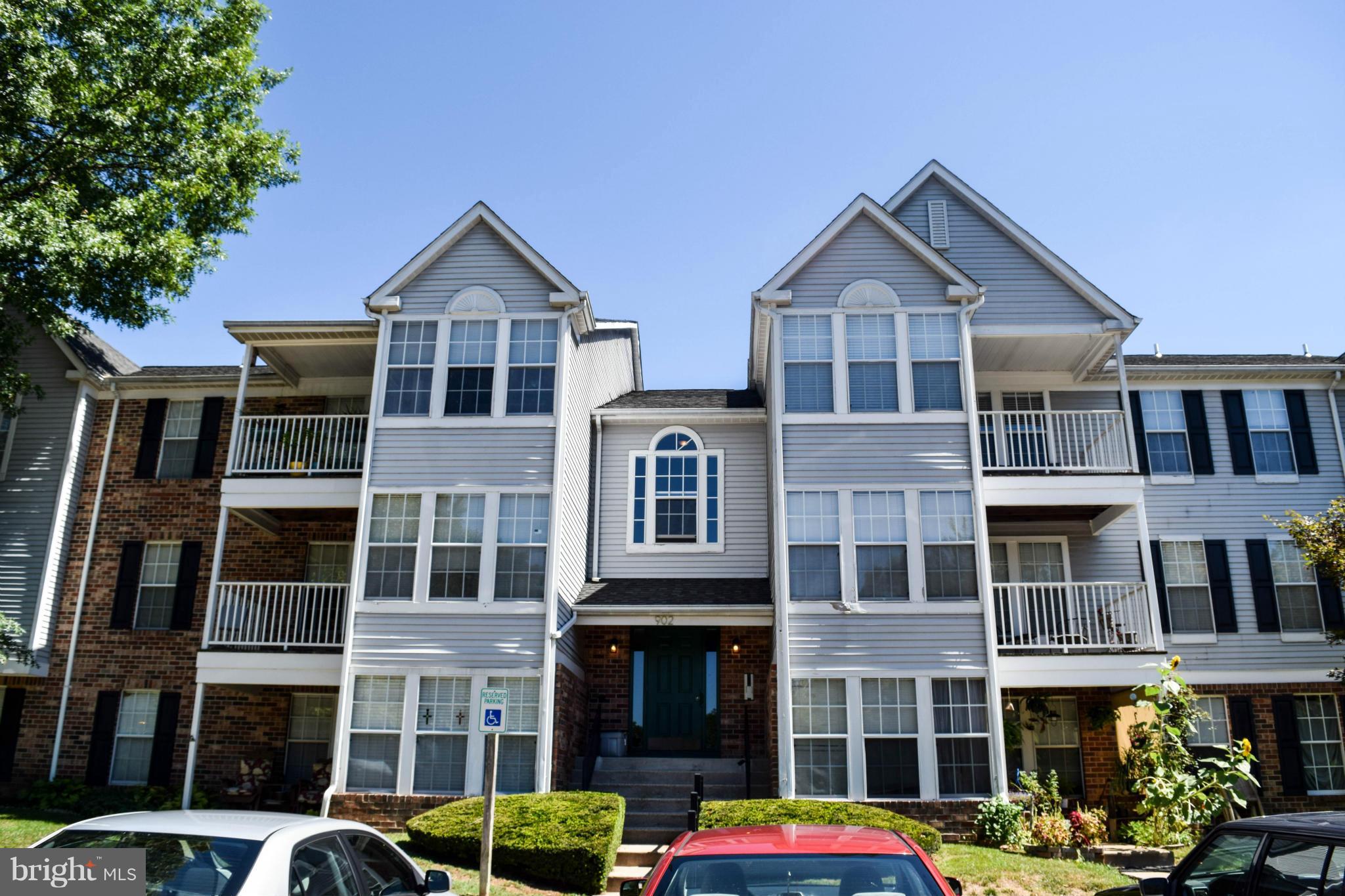 Beautiful top floor condo shows like a model home! New windows, new carpet, fresh paint, updated master bath, vaulted ceilings and tasteful decor throughout. Breakfast bar & large pantry in Kitchen. Sun Room with hardwood floors opens to covered deck overlooking wooded area. Private laundry in-unit. Great location close to everything! Must see!