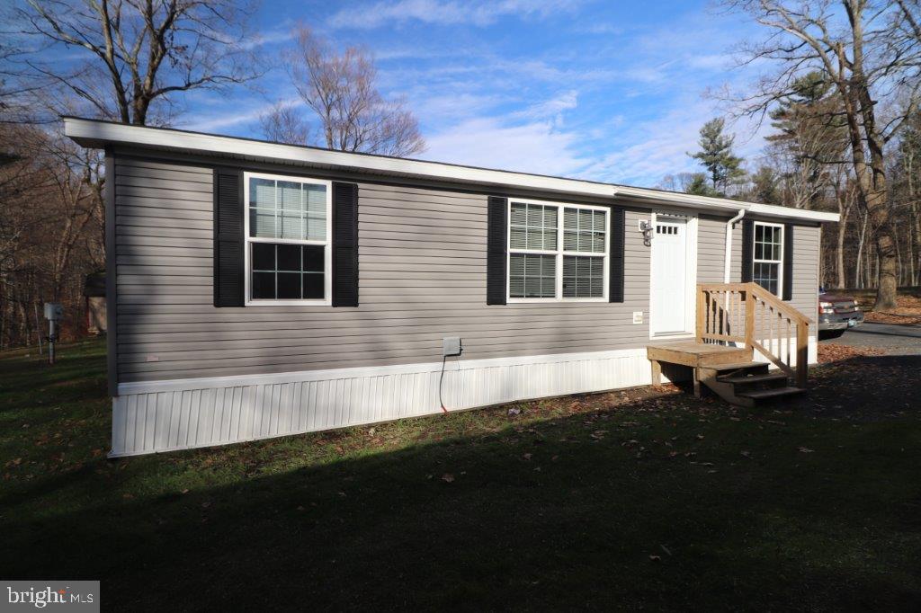 YOU'RE GOING TO LOVE THIS spacious 3-BR, 2-BA home located towards the end of a cul-de-sac road in the community of Birchwood Park! You're greeted with the open floor plan allowing you to walk easily throughout the home. The living room opens out to the eat-in-kitchen featuring wood cabinets, Formica counters, and all appliances. Master bedroom includes a spacious walk in closet, separate double vanity with seated walk-in shower in the Master bathroom. 2 equally sizeable bedrooms, full bathroom and laundry area are located on the other side of the home. Conveniently located in Birchwood Community Park, close to Blue Mountain Ski, Blue Mountain Winery and other Pocono tourists attractions. Whether your looking for a full time or seasonal residence it's location is close to Rts. 209 & 33 for perfect commuting! $595 mo. lot rent incl. W/S/G and community ammenties! Call Today! BUYERS: Please make sure your approved for manufactured home financing . . VA, FHA, USDA or Conventional mortgages will not qualify for these homes. Current pictures on listing are from when home was listed in November 2024, Updated photos will be taken once tenant vacates home. Call listing agent with any questions.