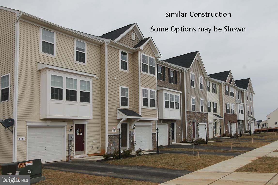 Dan Ryan Builders at Stonebrook Village offers a spacious end unit York II garage townhome with stone front detail,  8x12 Morning Room expanded plan opening up space on all 3 finished levels!  Huge owner's suite & deluxe bath. Island kitchen opens to the sunny morning room to have your morning coffee or gather friends & family. Double room finished lower level with bath rough in. 2x6 construction!