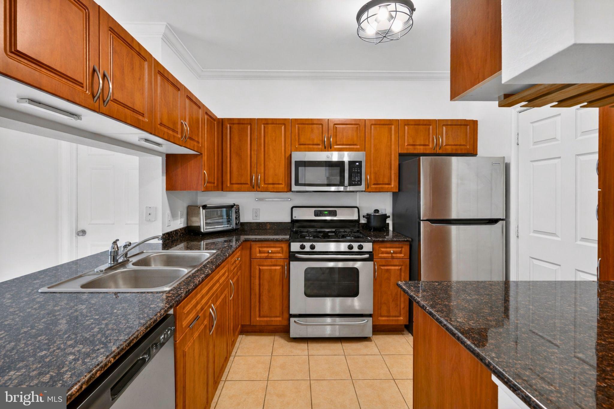 Spacious modern 2-bedroom condo in a gated community near Herndon Metro.
This stunning 2-bedroom, 2-bath condo features an open floor plan that creates an easy flow between the combination kitchen, dining, and living areas. The kitchen flows right into a breakfast nook and a family room, and there's a built-in bar that’s perfect for hosting or casual dining.
The home has carpet flooring throughout, ceiling fans, and a fireplace in the living area that serves as a cozy focal point.
The large bedrooms are equipped with custom walk-in closets and sleek bathrooms. Appliances include a microwave, dishwasher, disposal, and gas water heater. An in-unit washer and dryer is also provided.
The condo comes with one parking space in a covered garage.
Residents enjoy access to community amenities such as a clubhouse, fitness center, pool, and well-maintained common grounds.

This condo is located just minutes from the Herndon Metro and major commuter routes, including Monroe Street, Sunrise Valley Drive, and the Dulles Access Road Route 267. The location provides quick access to Reston, Tysons, Dulles Airport, and Washington, DC, while also being close to local coffee shops, parks, walking trails, and everyday shopping.

If you are looking for low-maintenance living with strong commuter access and desirable community amenities, this home is worth a closer look. Schedule your tour today!