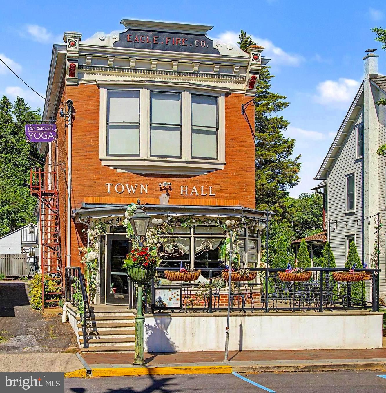 One of the best buildings in New Hope is now for sale!!! Positioned in the heart of downtown, 41 N Main Street presents a rare opportunity to acquire one of the borough's most iconic and historically significant commercial properties. Rich in character and deeply woven into the fabric of New Hope's history, this landmark building formerly served as the Town Hall, Police Department, and original Firehouse, offering an irreplaceable presence along one of Bucks County's most coveted locations. The property is anchored by a highly successful, established restaurant and café operation with strong lease terms, providing dependable income and long-term stability. Further enhancing the investment profile is a separately operated 19-space parking lot with a self-operating kiosk, generating direct revenue for ownership and creating a valuable income stream in a market where parking is at a premium. Additional income-producing components include a well-maintained two-bedroom residential apartment, four professional office suites, and a detached four-car garage, creating a diversified and resilient investment opportunity. Multiple revenue streams combine to produce an attractive cap rate and exceptional long-term value. Meticulously maintained and strategically located amidst New Hope's vibrant collection of restaurants, boutiques, galleries, luxury residences, and year-round tourism, 41 N Main Street offers investors the rare combination of historic significance, stable cash flow, and future appreciation potential. Opportunities of this caliber rarely become available. Whether seeking a legacy asset, a cash-flowing investment, or a cornerstone property in one of Pennsylvania's most desirable destinations, 41 N Main Street represents a truly exceptional acquisition.