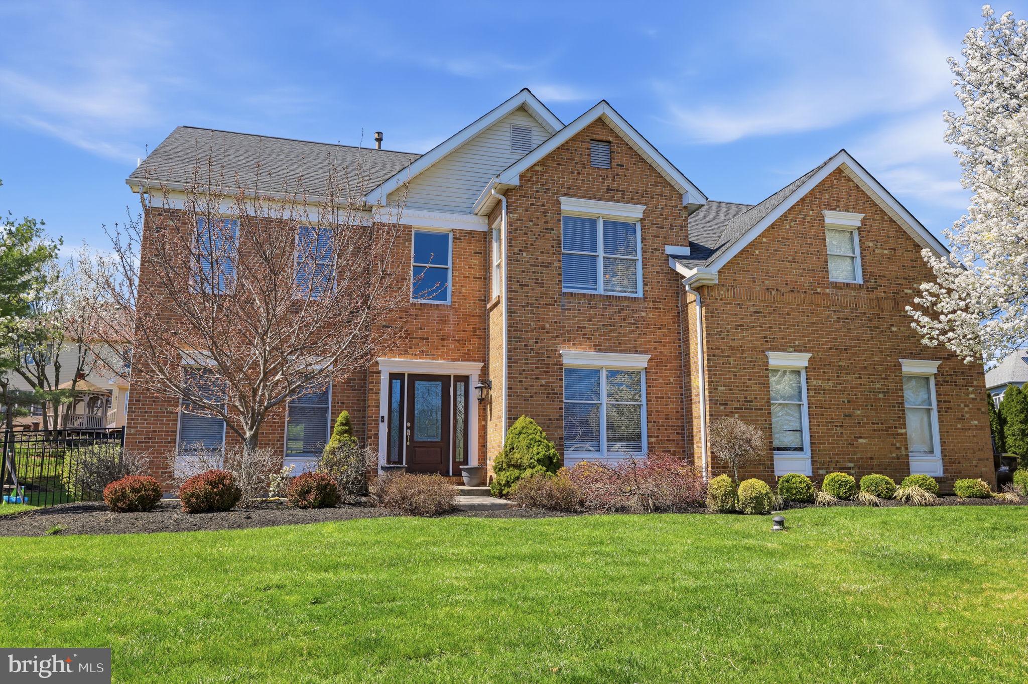 Welcome to this beautifully updated 3,500 sq ft brick-front Colonial located in the desirable Heather Ridge section of Newtown within the award-winning Pennsbury School District. Professionally landscaped grounds and a striking leaded glass front door set the tone for the impressive interior, featuring a two-story foyer with porcelain tile flooring and luxury vinyl plank throughout the main level. The fully renovated kitchen showcases soft-close cabinetry, a center island, quartzite countertops, tiled backsplash, and stainless-steel KitchenAid appliances, along with a bright breakfast area accented with a skylight, with seamless access through a newer sliding glass door to an elegant patio. The adjacent family room offers a vaulted ceiling, skylights, wood-burning fireplace, and a convenient back staircase. A combined living and dining room with decorative ceiling molding, along with a first-floor laundry room, complete the main level. Office off entry foyer.  Upstairs, you’ll find four spacious bedrooms and two fully remodeled bathrooms, including a luxurious primary suite with a sitting area, custom walk-in closet with built-ins, and a beautifully updated bath with ceramic tile, tiled shower, double vanity, and soaking tub. The finished basement (2020) adds additional living space, while the fenced backyard is an entertainer’s dream with a gazebo (2022) and gas firepit. Additional upgrades include interior painting (2024), HVAC (2022), roof (2017), and a two-car garage equipped with an EV charger.  Enjoy an exceptional lifestyle with abundant parks, recreation, dining, and shopping just minutes away. Nearby Tyler State Park offers over 1,700 acres of scenic trails, biking, kayaking, and picturesque creek views, while Core Creek Park features Lake Luxembourg, boating, walking paths, and one of the area’s best dog parks. Closer to home, neighborhood favorites like Roberts Ridge Park, Helen Randle Park, and Veterans Park provide playgrounds, sports fields, and easy access to local walking trails. Historic Newtown Borough and nearby Yardley Borough offer a charming mix of boutique shopping, cafés, and top-rated restaurants, while convenient access to the Village at Newtown and surrounding retail corridors ensures everyday essentials are always within reach—creating the perfect blend of small-town charm, modern convenience, and an outstanding lifestyle.