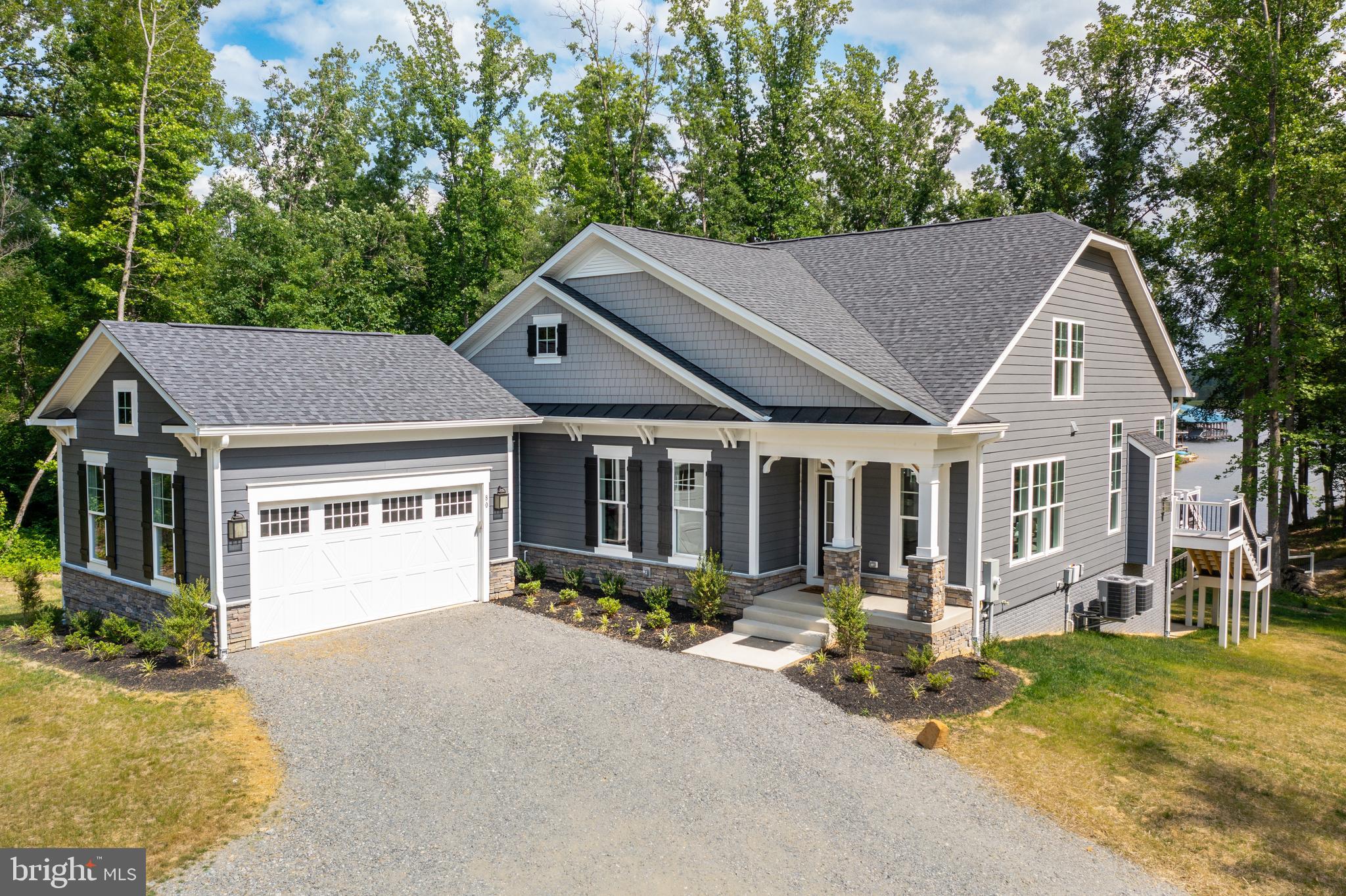 Waterfront To-Be-Built Craftsman Home in Compass Cove, Lake Anna’s brand-new lakefront community on the private side! This stunning to-be-built home offers the perfect blend of comfort, style, and lakeside living. This Banyan II floor plan will be constructed by Evergreene Homes, a luxury award winning builder here at Lake Anna!

The home features 3 bedrooms and 3 bathrooms, the main level boasts an open-concept floor plan designed for modern living. Enjoy gatherings by the fireplace in the spacious living area that opens to a composite deck overlooking peaceful lake views, the ideal place for morning coffee or just pure relaxation. The primary suite is conveniently located on the main level, offering privacy and comfort. Upstairs, you’ll find two additional bedrooms, a full bath, and an oversized loft overlooking the main living area. The space is perfect for a play area, home office, or entertainment space. The partially finished basement adds even more flexibility with a large recreation room and plenty of space to customize — imagine a home theater, fitness studio, or hobby room. The possibilities are endless! Experience the best of lake life in this thoughtfully designed home, just steps from the water in one of Lake Anna’s most exciting new communities!!

We currently have the same floor plan close-by for showings! Pictures used are from a different build, there may be different selections chosen, they are for reference only. This home is due for completion Dec 2026/ Jan 2027.