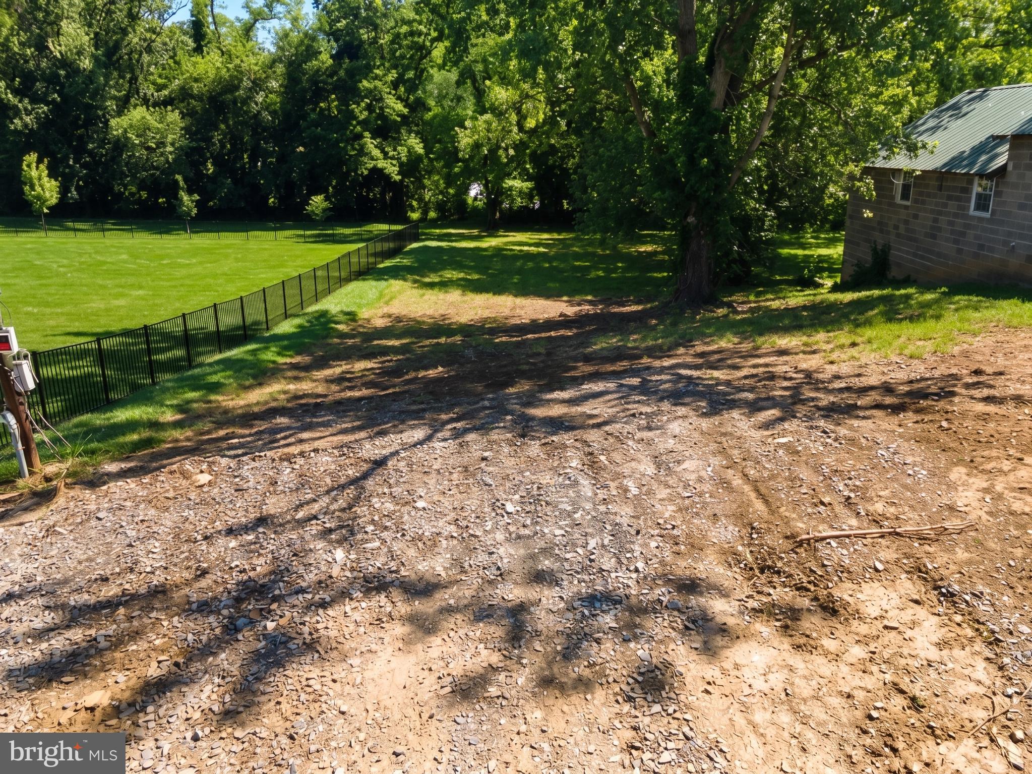 Build your dream home on this private, ready-to-build 0.29-acre lot located on a quiet dead-end street. A recent survey has been completed, and the front portion of the property has been removed from the floodplain (LOMA Certificate No. 17-03-1155A-420926), allowing a home to be constructed on the front half of the lot without the need for flood insurance.

Public sewer is available at the property line with the tapping fee already paid by prior owner  (approximately $4,500 value). Public water and natural gas are already on the property. Electric service is available, with the utility company to install a pole for service to the home.

Surrounded by mature trees with a creek along the property, this lot offers a peaceful setting while remaining convenient to local amenities. The borough is known for a straightforward permitting process, and both single-wide and double-wide manufactured homes are permitted. Although the lot is narrow, it provides an excellent opportunity for buyers seeking an affordable, utility-ready homesite with many of the upfront improvements already completed.