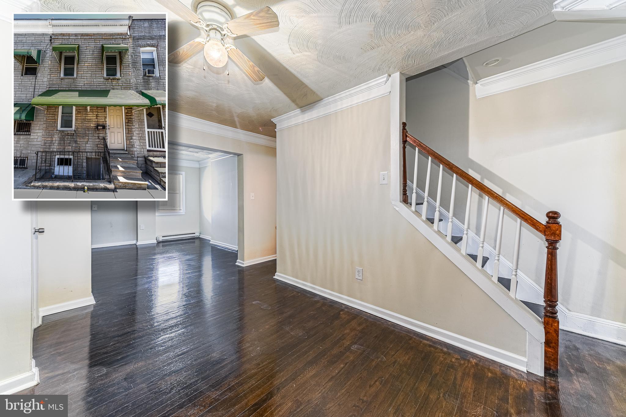 MOVE IN READY UPDATED ROWHOME WITH 3 FINISHED LEVELS!  Refinished hardwood floors throughout the main level, spacious living room, separate dining room, and kitchen, upper level with 2 large bedrooms and 1 full bath, finished walk-out lower level with a family room or 3rd bedroom, 2nd full bath, and laundry room, 2nd level rear deck, fenced yard, and off street parking!