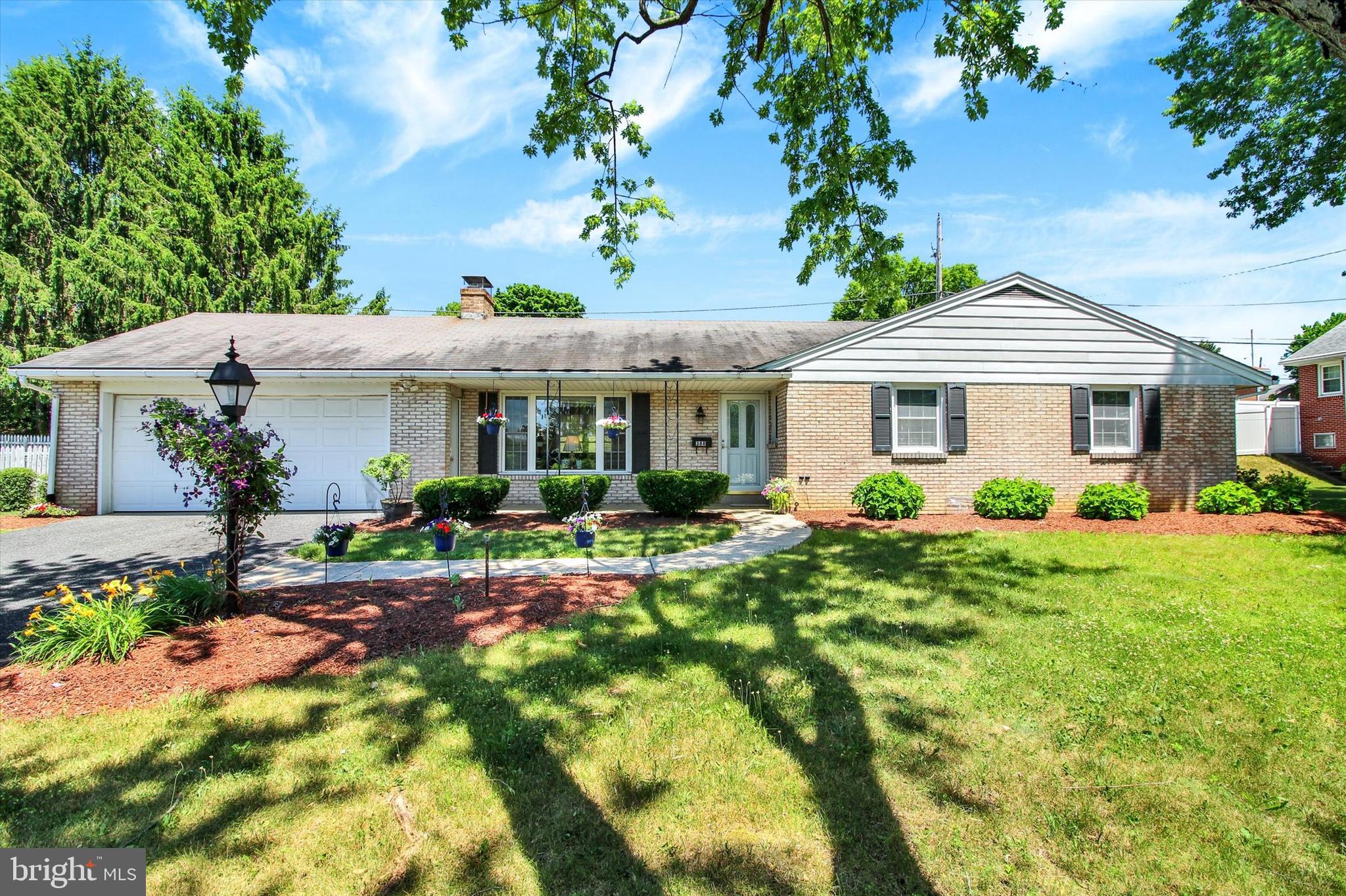 This charming 3 bedroom rancher is nicely situated on a .33 acre lot in Hamburg School District and conveniently located close to major routes and shopping. You will love the welcoming front porch, the patio in the rear for entertaining, and the 2-car attached garage! Inside, the main floor boasts beautiful, original hardwood flooring throughout, as well as a spacious family room with a stone fireplace and plenty of natural light, an eat-in kitchen, three ample sized bedrooms, and a full bath. The large basement also provides another bonus bathroom, plenty of room for storage, a workshop, and even more possibilities. Other notable features of this home include newer A/C (installed in 2020) and heating system (2012), a backup generator that will give you peace of mind when the power goes out, and replacement windows throughout the home for added efficiency.