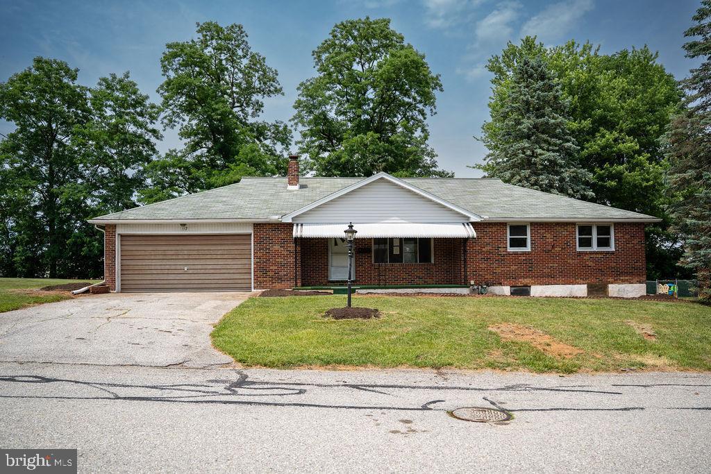 Tons of potential with this solid brick rancher in Shrewsbury.  Convenient and commuter friendly location with easy access to I-83/Maryland, shopping and daily conveniences.  The main level boasts living room with bay window, kitchen and dedicated dining room, three bedrooms with original hardwoods, full bathroom plus an additional full bath/laundry room off the garage. The lower level offers another 1000+ square feet that could be easily finished to provide additional living  space.