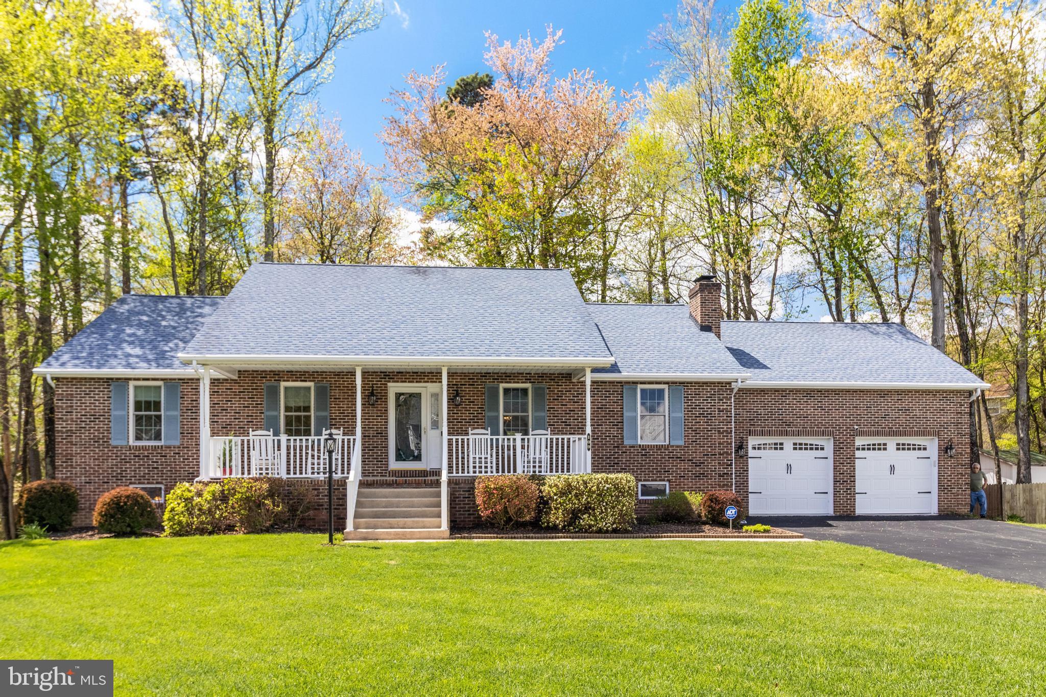 This beautiful 4 Bedroom, 3 Full Bath, Rambler with Basement, is the epitome of "pride of ownership."  The original owners have maintained this home with delicate hands inside and out!  You'll realize it's a special home upon arriving and seeing the plush lawn, inviting front porch, and great curb-appeal.  Upon entering, you will immediately fall in love with the open floor plan.  Nestle into the warmth of the Living Room, with Cathedral Ceilings and modern Ceiling Fan, with a flip of the switch to ignite the propane fueled Fireplace.  Enjoy cooking and dining in the Kitchen and Formal Dining area overlooking the large 22' x 14' deck and park-like back yard.  Everyone will sleep comfortably in the each of the large bedrooms - highlighted by the 17' x 13' Primary Bedroom with adjoining Primary Suite.  Upon arriving at the lower level, you'll wonder if it "goes on forever."  You'll be the envy of all of your guests as you entertain in the open Family Room / Game Room combination.  Flip another switch, and you will enjoy the warmth of your second fireplace.  Overnight guests will feel right at home in the naturally sunlit 4th Bedroom on the lower level - with a Full Bath right around the corner.  And working from home (or getting away for peace and quiet) won't be an issue because you can have your own private Office.  And if you enjoy the fresh air of the outdoors, you'll have your pick of a covered front porch, large deck, or cozy patio to enjoy your favorite morning or evening beverage.  This home is truly "move in ready" and has recently been freshly painted and installed new carpeting throughout.