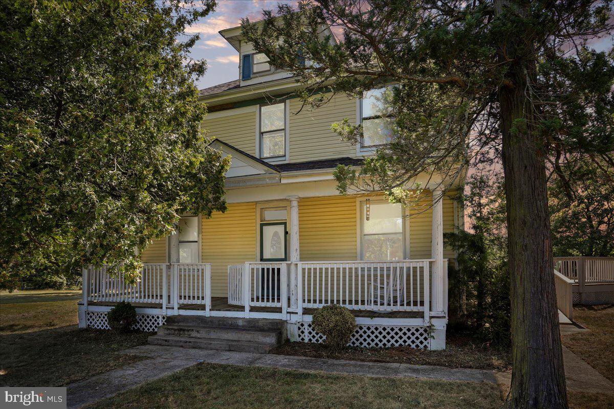A must see and an awesome location!  If you’ve been searching for a home with real charm and a story to tell, this one will capture your heart the moment you see it. 
This beautifully cared-for home sits on 1.09 unrestricted acres with breathtaking mountain views from the upstairs bedrooms — the kind of property that feels peaceful and full of character. According to the current owner, it may even be one of the original Sears kit homes from the early 1900s — a true piece of American history, built with the kind of craftsmanship you just don’t find anymore.
Inside, you’ll fall in love with the details: original solid wood floors, beautiful trim work, pocket doors, and a grand staircase that instantly transports you back in time. Tall ceilings and large windows fill every room with natural light, giving the whole home a bright, welcoming feel.
And while the charm is timeless, the comfort is completely modern. The home features an updated roof, energy-efficient mini-split systems, and new decks designed for relaxing or entertaining — including space for a hot tub where you can unwind and watch the sunset over the mountains.
The unrestricted acreage gives you room to live your way — garden, raise chickens, or just enjoy the space and fresh air. There’s even a chicken coop and workshop with power, storage, and a garage-style door, perfect for hobbies or projects.
Located just seconds from War Memorial Hospital and minutes from downtown Berkeley Springs, you’ll love being close to shops, dining, and local events while still enjoying the quiet and beauty of country living.
This isn’t just a house — it’s a home with history, heart, and so much warmth. This home is just waiting for a new owner to love it and take care of its historical charm for years to come! Come see why so many people fall in love with Berkeley Springs living — and why this one-of-a-kind home could be the perfect place for your next chapter. Motivated seller - bring offers!
