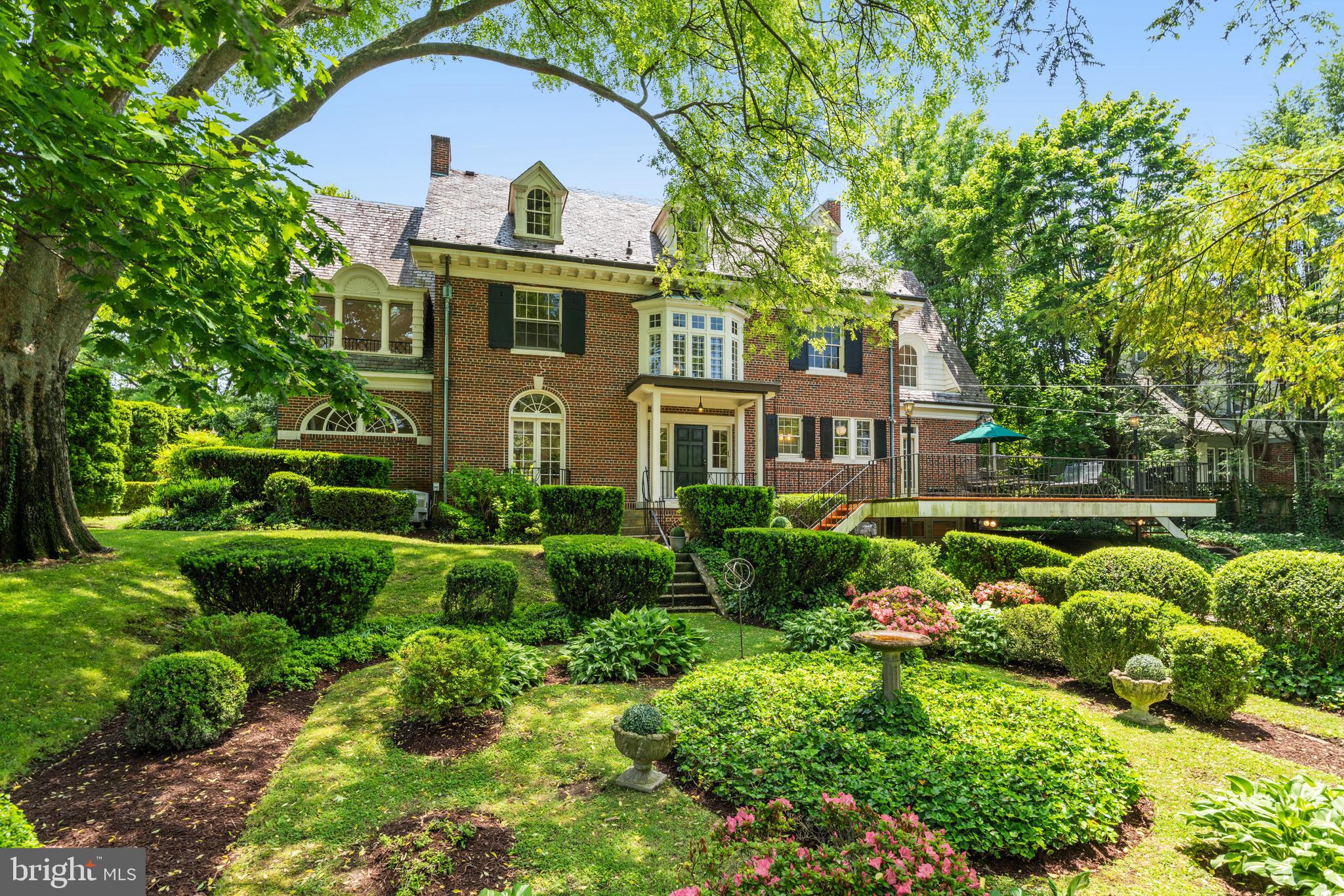 No need to focus on the Western Avenue address - with an additional prominent entrance from Oliver Street, this home lives as if it fronts Oliver Street! Finally - an opportunity to make one of the most noteworthy properties in Chevy Chase Village your own. Home to the same family for decades, this Georgian colonial was built in 1918 as the model home to the "newer" section of the Village and is expectantly awaiting its next steward. Set back from the street behind a private hedge on a spectacular double lot of nearly half an acre, the light-filled home with over 6,400 sf of living space was constructed with the highest end finishes of the day. While the home is in need of updating, buyers will be glad to see that many of the original details are still intact, including beautiful Palladian windows, amazing fixtures and hardware, intricate plaster moldings, 9+' ceilings on the main and second levels and incredibly gracious room sizes.  A center hall entry looks through to a matching arched entryway and opens to a generous and deep foyer. A grand piano sized living room encompasses the depth of the house and opens to the family/sunroom with original herringbone brick floors, gorgeous French doors and Palladian windows leading to and overlooking the side patio enclosed by a semi-circle secret garden of stunning mature plantings. Dining and breakfast rooms are found with the kitchen on the other side of the foyer; the dining room also has original French doors to the front. The rear foyer and kitchen open to a deck and the elegant landscape and pool-sized grounds of the property. The second level features three bedrooms and two baths, including the primary with ensuite bath and a large sitting room with vaulted ceiling. Two additional bedrooms, a sitting room and bath are on the third level. The lower level space includes a recreation area, a bedroom suite with access from the driveway, laundry and bonus space. Metro and the shops and restaurants of both Connecticut Avenue and Friendship Heights are within blocks, as are many parks, playgrounds, schools and clubs. The Capital Crescent Trail and Bethesda are also nearby and enjoyed by Village residents. Chevy Chase Village has its own post office, police department and administration, providing residents many amenities including daily house checks by the police department to households whose members are away, twice weekly trash collection, bulk pick up, numerous community parties, events, activities and more. So close to everything, this location is the perfect choice for those who desire a bucolic, established neighborhood with all of the conveniences of the city right at hand. Property is an estate and conveys in "As-Is" condition.